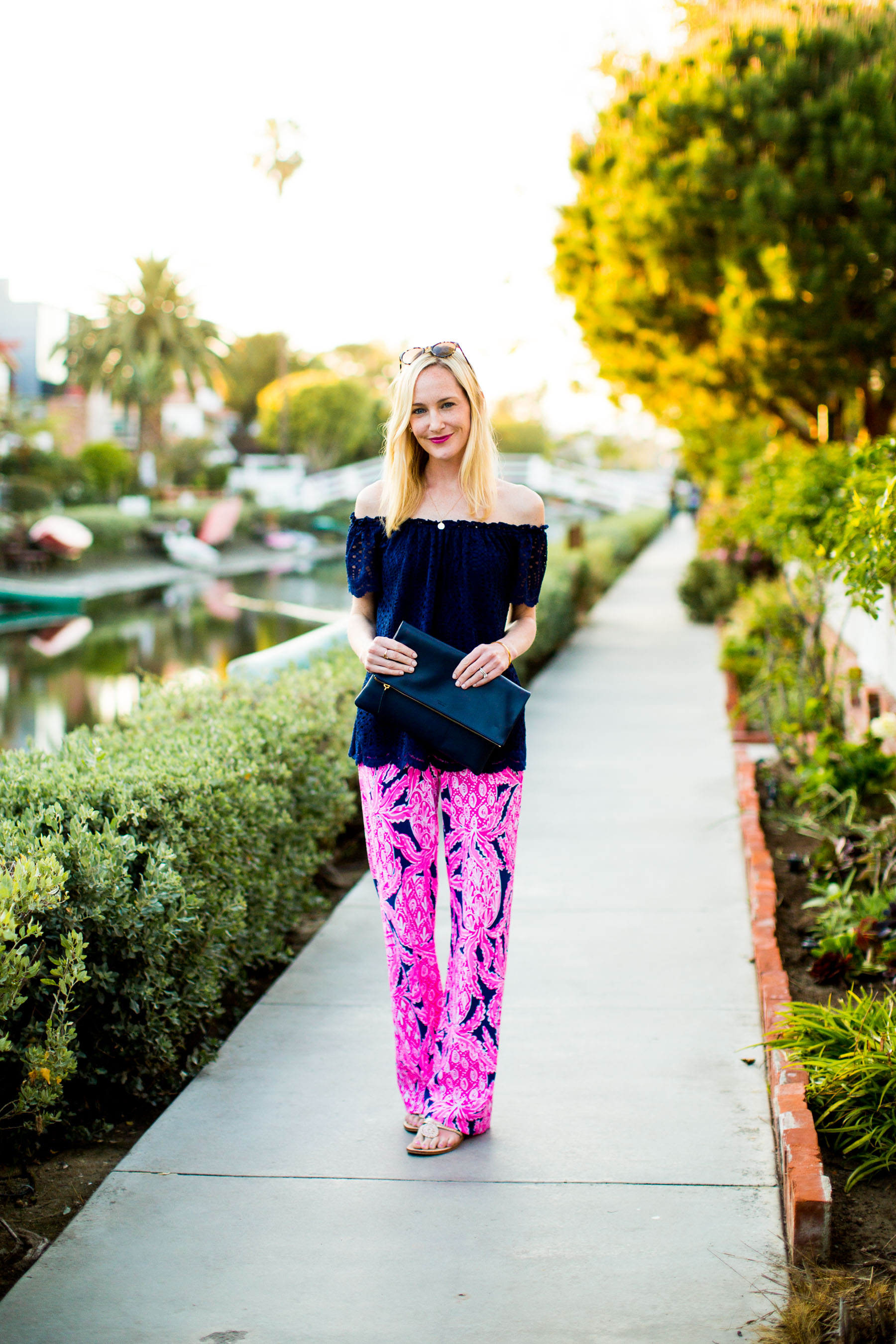 Lilly Pulitzer Pants and Off-the-Shoulder Top / Jack Rogers Flip Flop / Everlane Clutch 