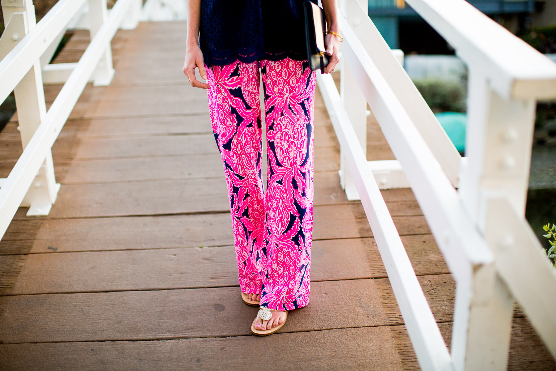 Lilly Pulitzer Pants and Off-the-Shoulder Top / Jack Rogers Flip Flop / Everlane Clutch 