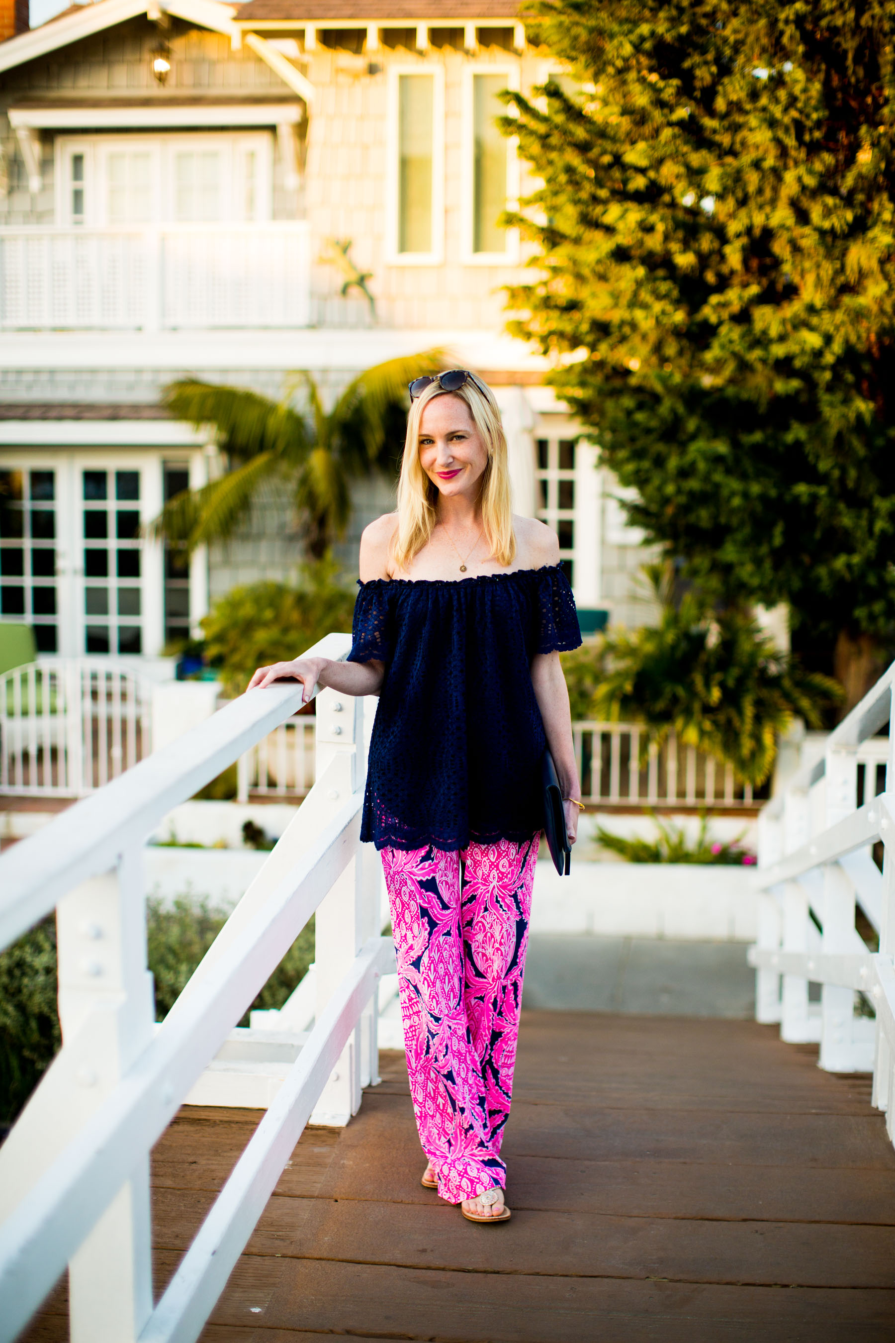 Lilly Pulitzer Pants and Off-the-Shoulder Top / Jack Rogers Flip Flop / Everlane Clutch 