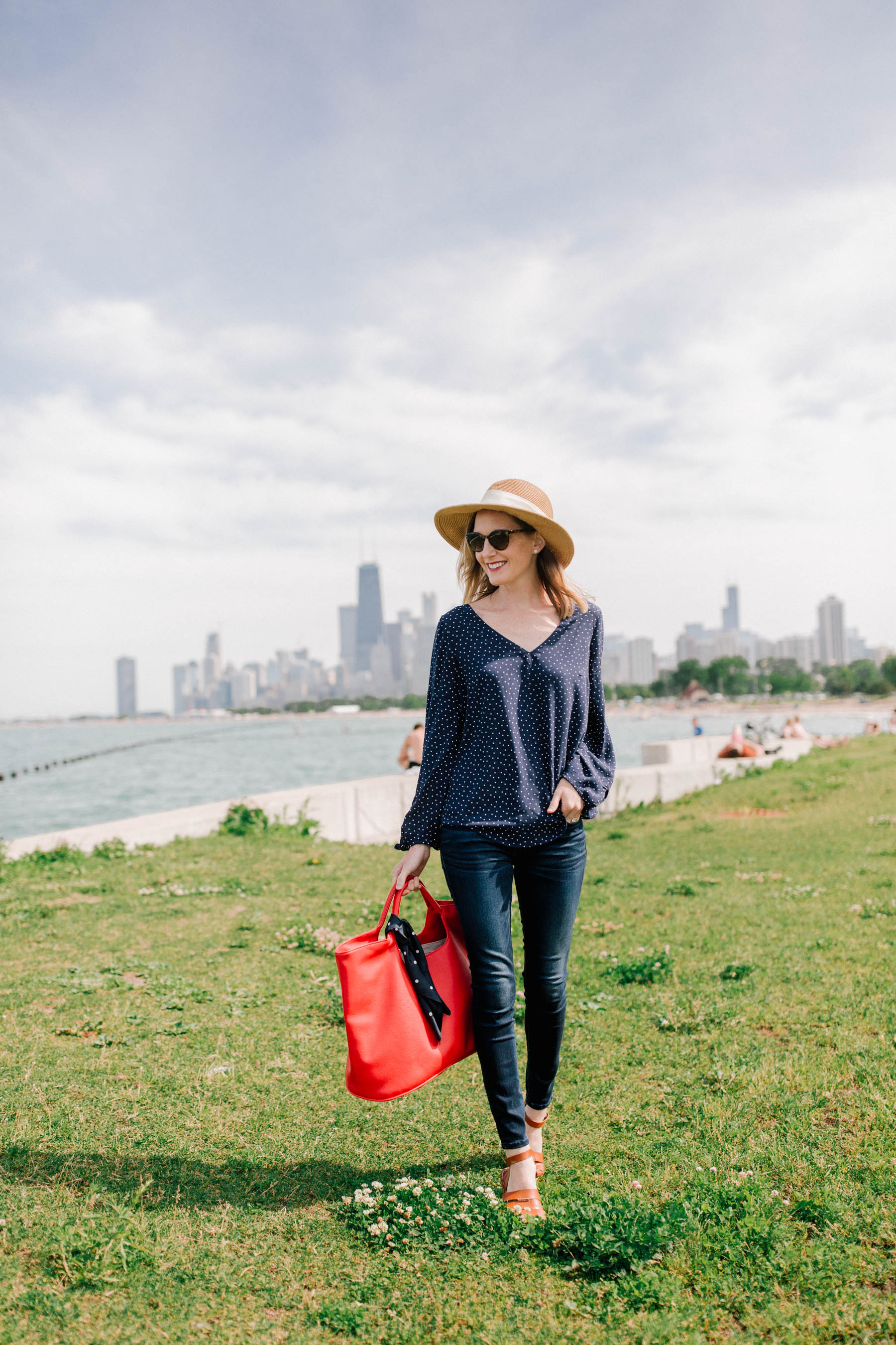 Navy polka dot top - Pernille Tie-Sleeve Blouse and Tuckernuck packable bow hat - Kelly in the City