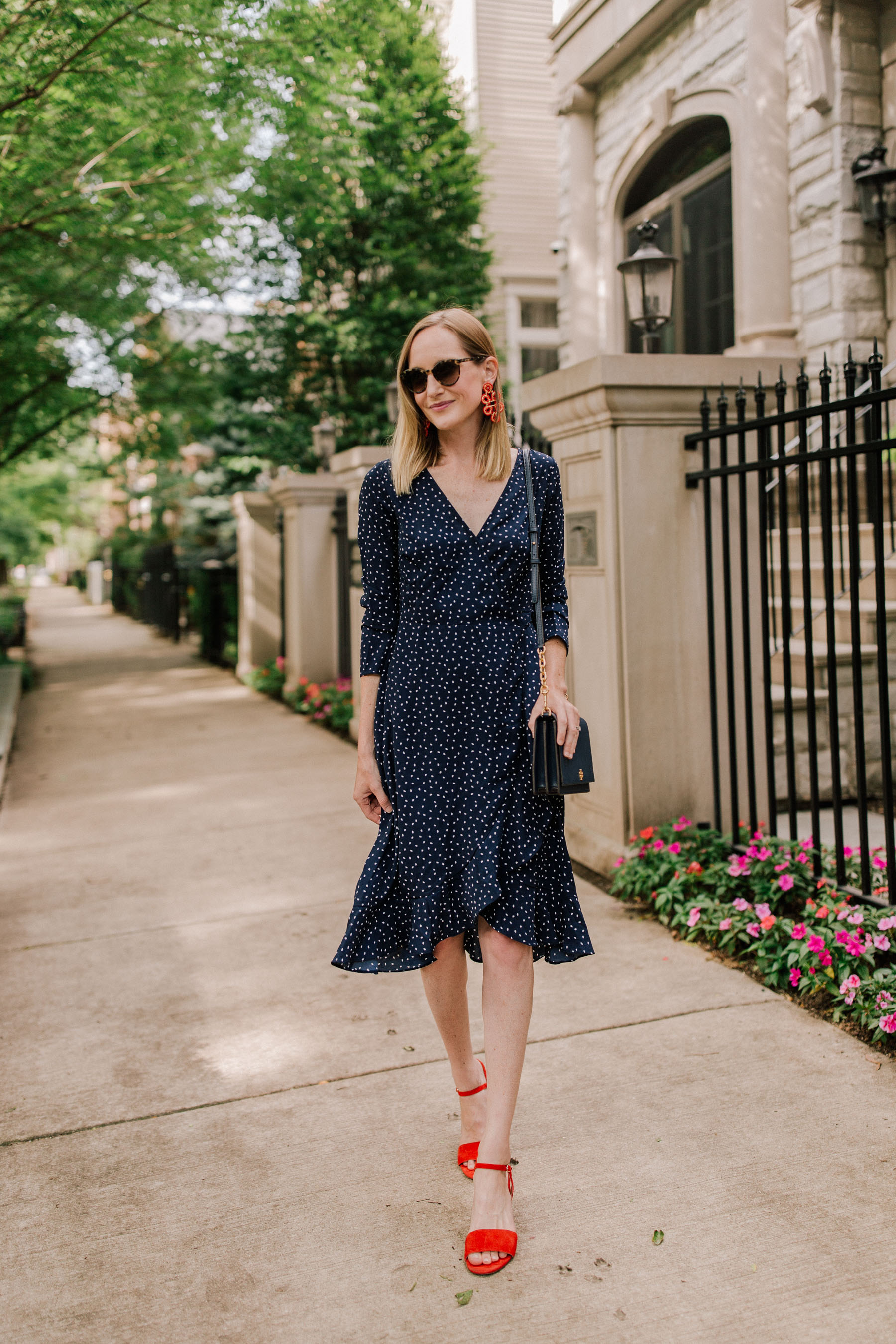 Nordstrom: Navy Polka Dot Dress / Tory Burch Navy Bag / Red Strappy Sandals (You can also find them at J.Crew.) - Kelly in the City