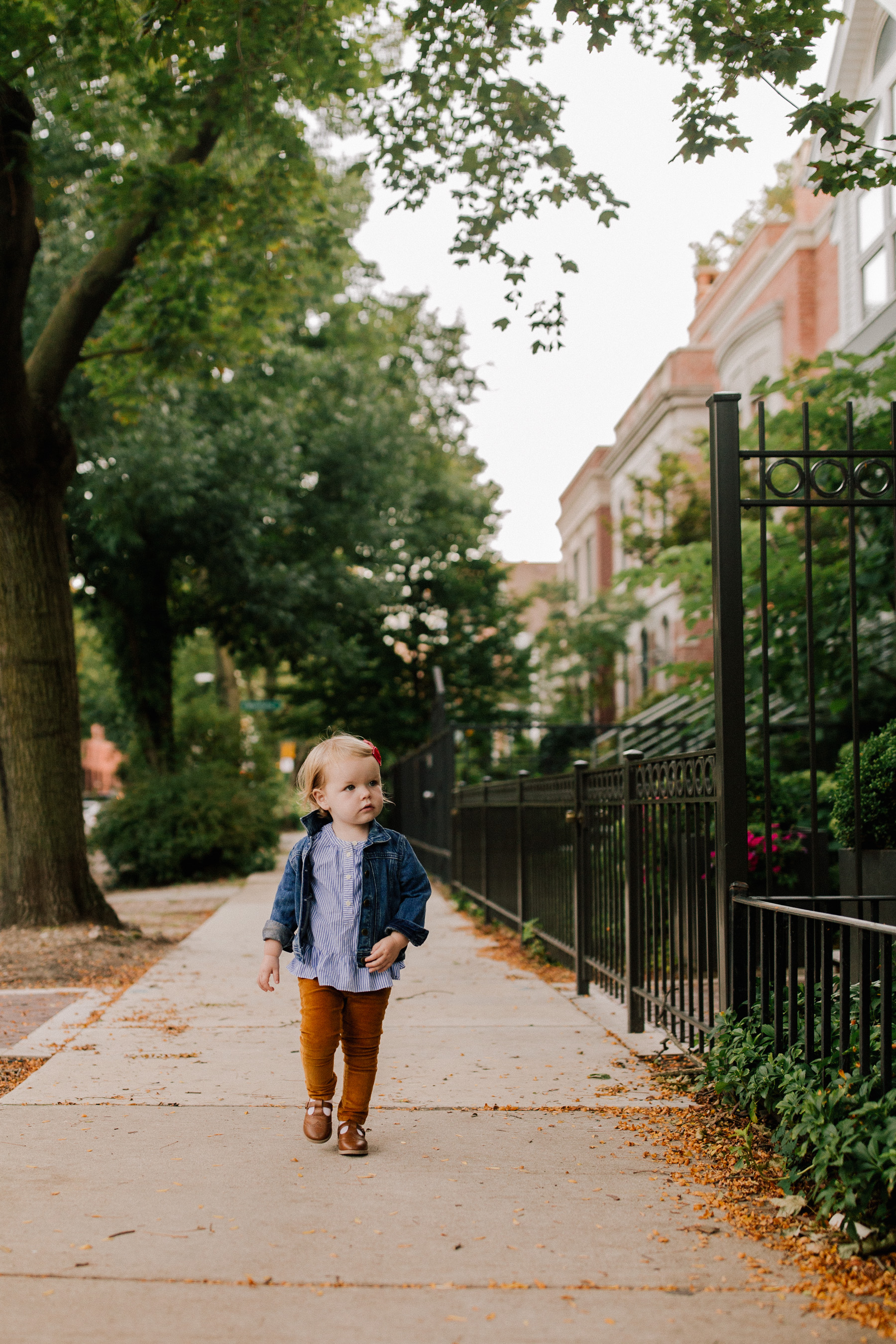 Emma is wearing a Stripe Ruffle Trim Shirt CREWCUTS BY J.CREW  and a Stretch Denim Jacket CREWCUTS BY J.CREW