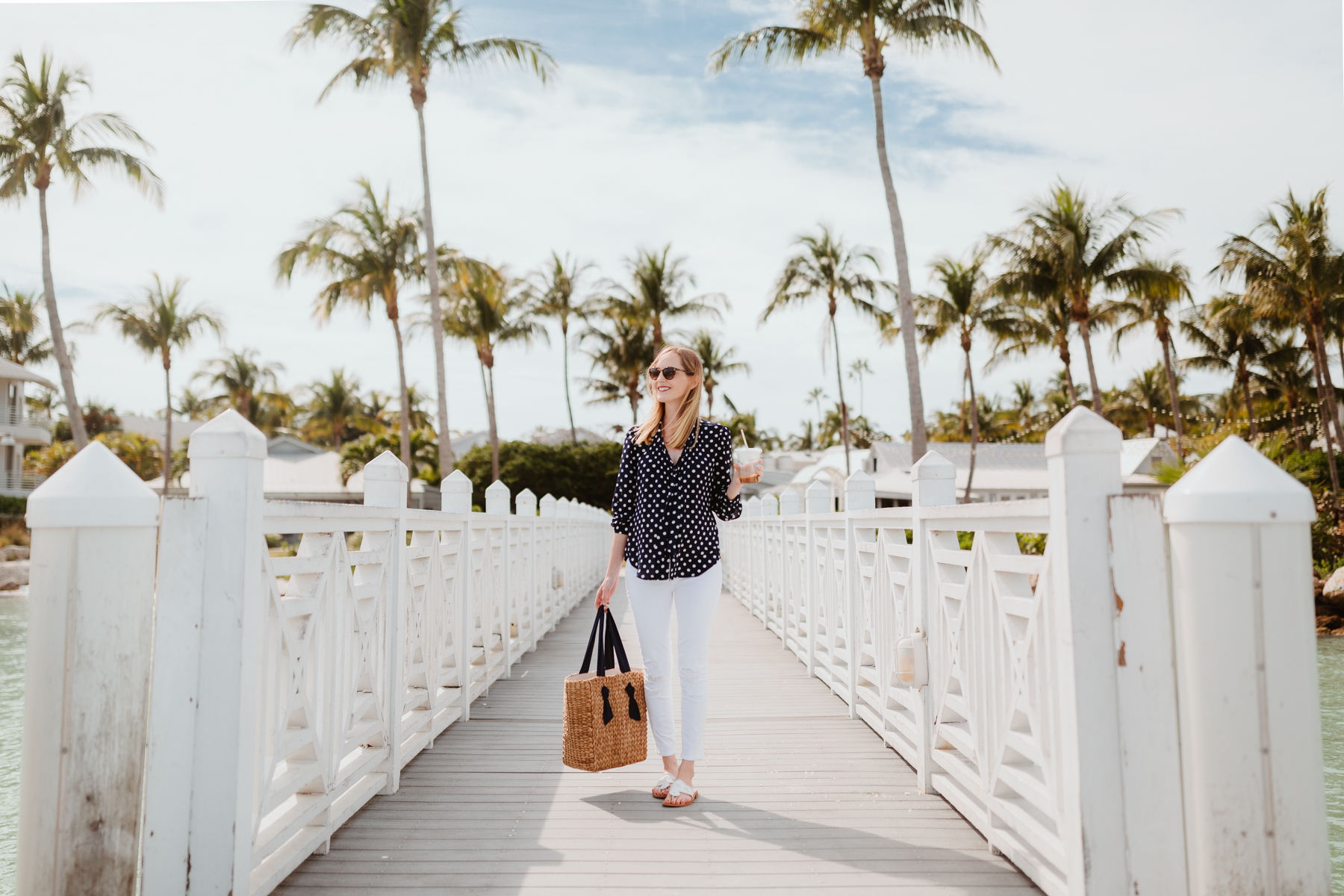 Kelly Larkin Outfit Details: J.Crew Navy Polka Dot Top / Pamela Munson Woven Tote / Jack Rogers / J Brand Maternity Ankle Jeans 