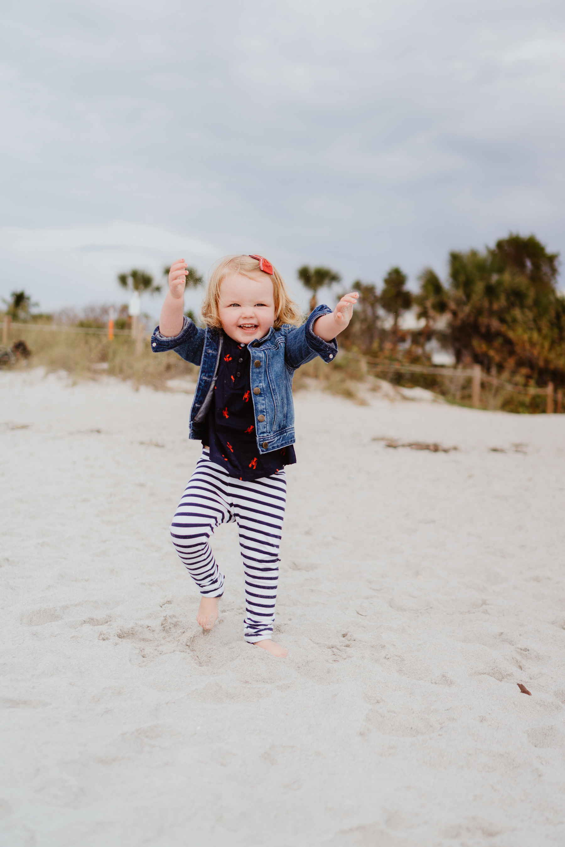 Baby girl playing at the beach