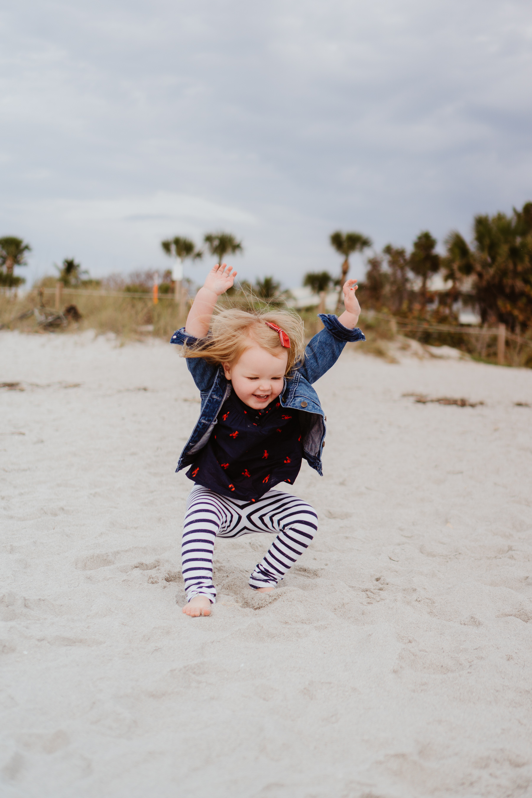 toddler playing at the beach