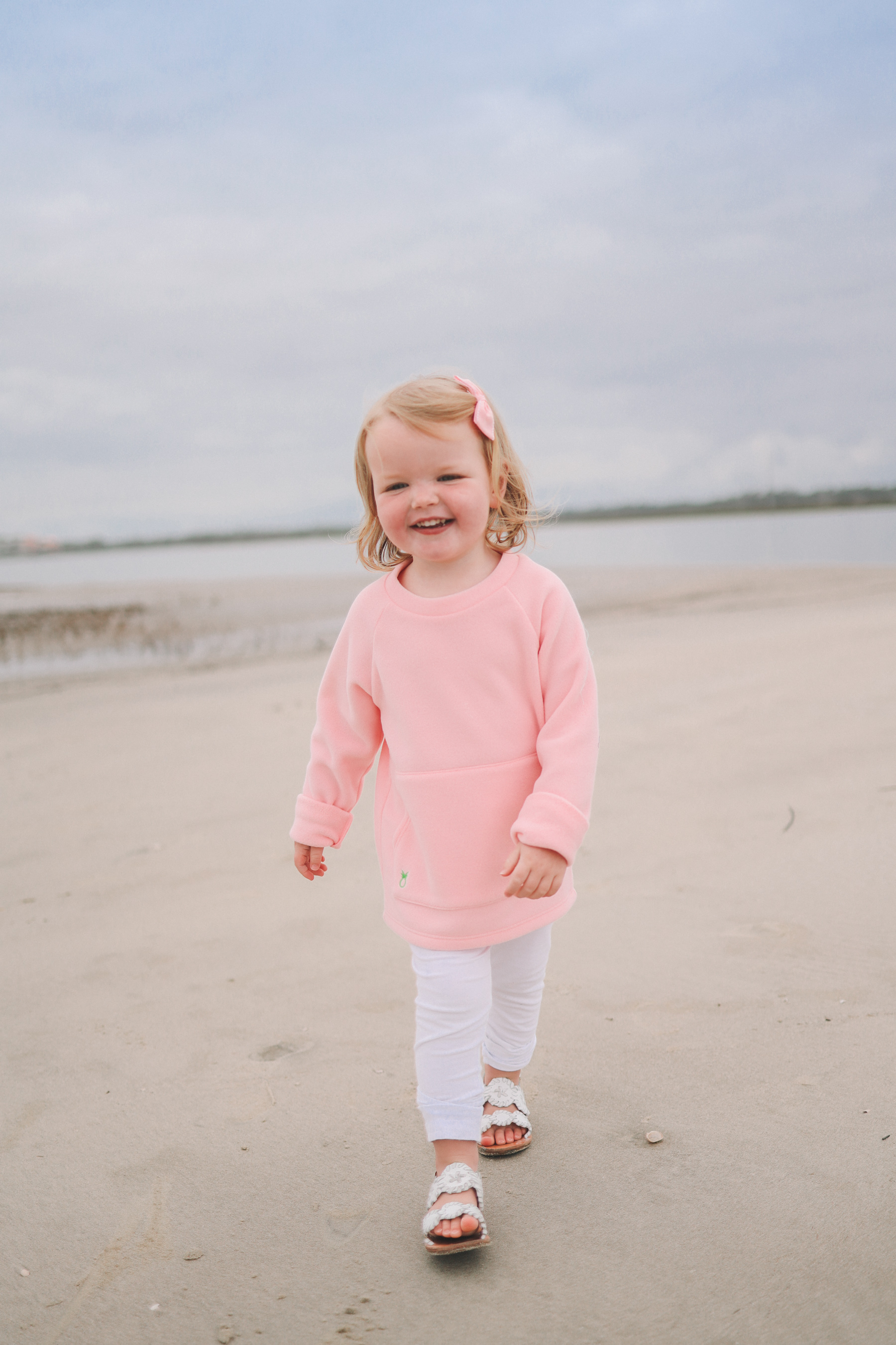 Emma Larkin's outfit: Dudley Stephens Kids' Crewneck, White Leggings and Jack Rogers Sandals.