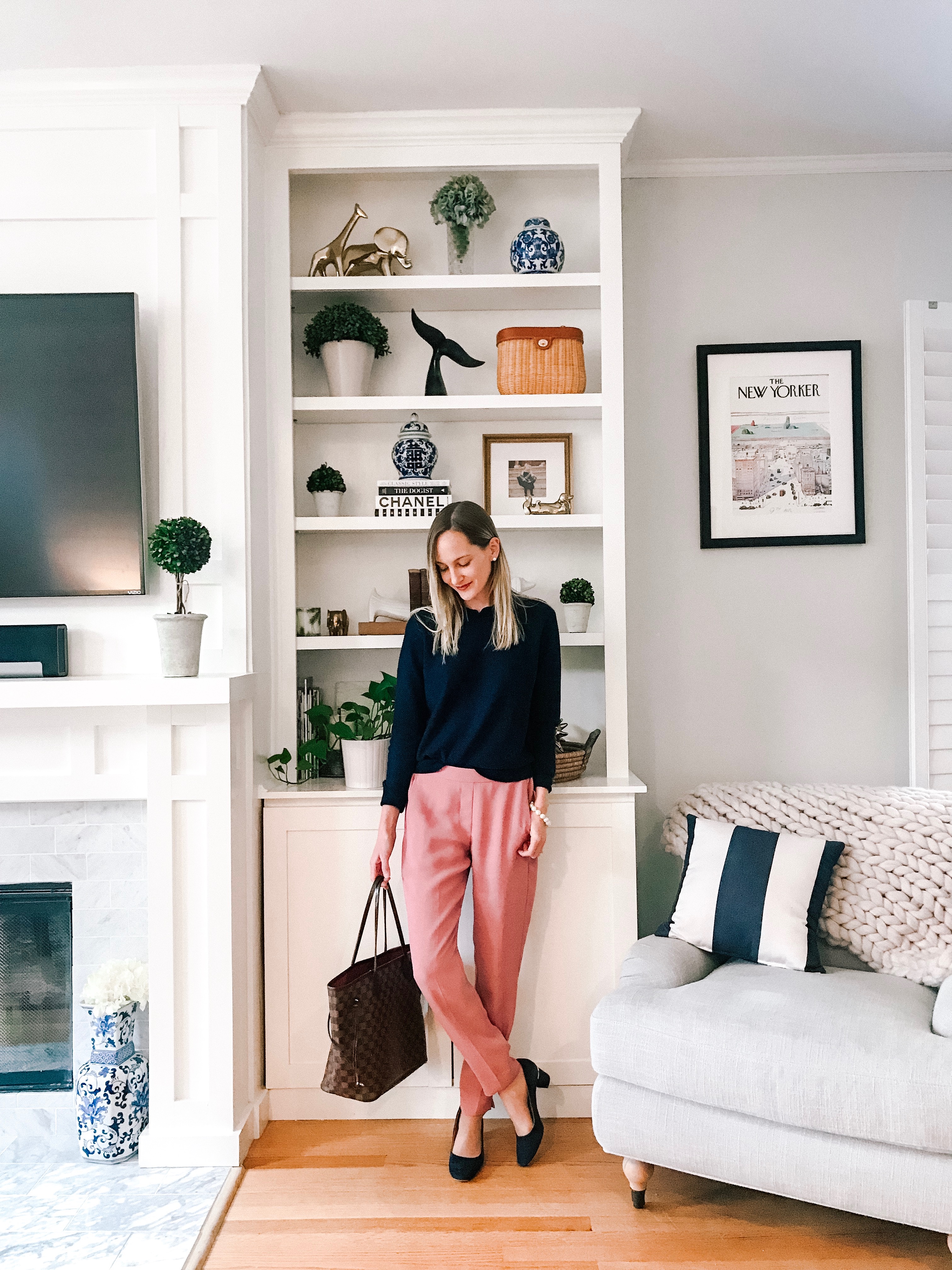 Photo details: Ruffled Sweater back in stock! (I would go a size up. I'm wearing a size medium here.) / Pull-On Dress Pants (Obsessed. On sale!) / Louis Vuitton Neverfull MM Tote / Favorite Pumps (SO comfy! TTS.) / Kate Spade Pearl Bracelet / Interior Define Rose Chair