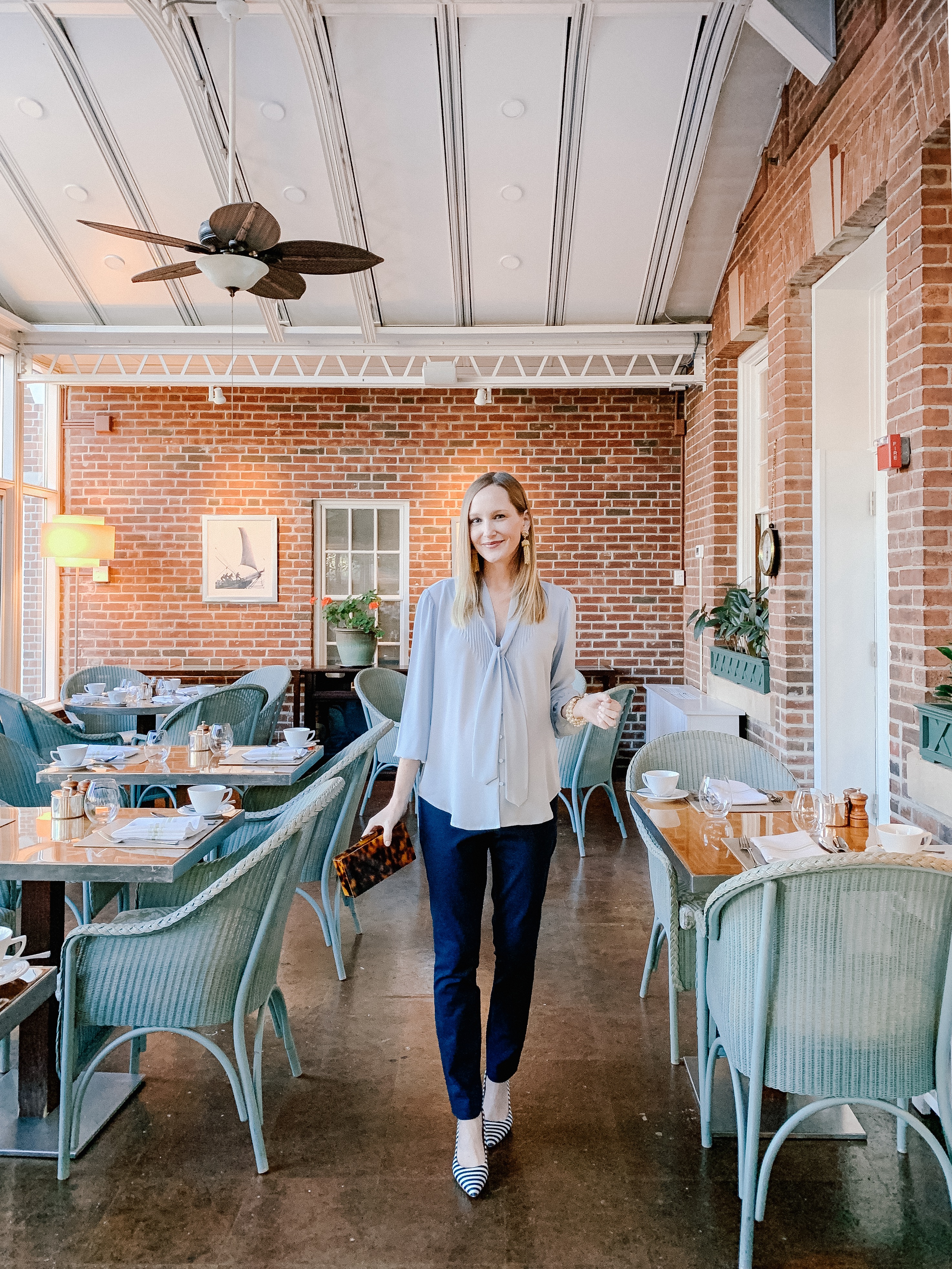 Kelly is wearing a Machine-Washable J.Crew Blouse that FEELS LIKE SILK 