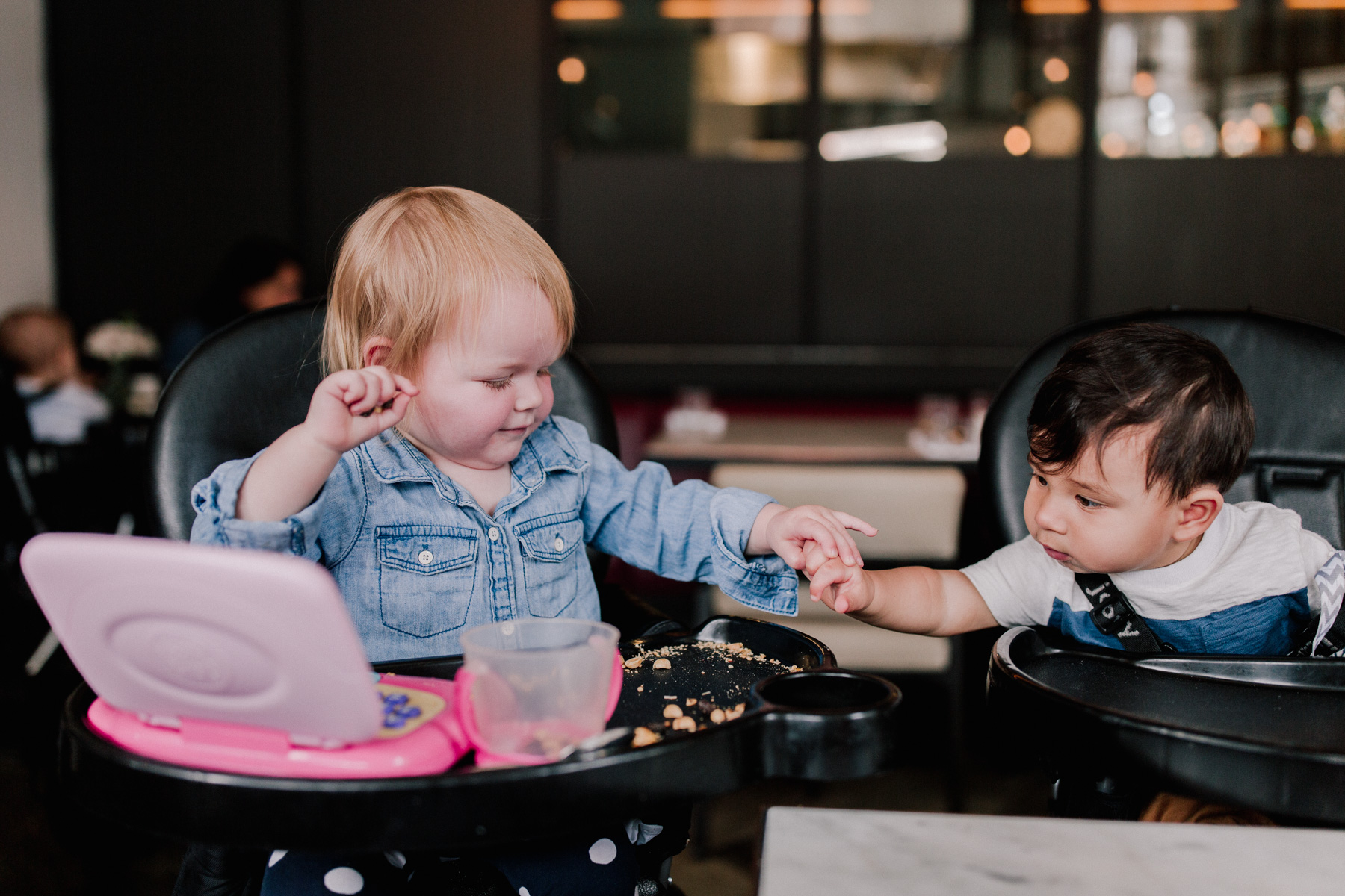 Emma and Zain. Yes, that's Emma slapping Zain's hand away from her snacks.