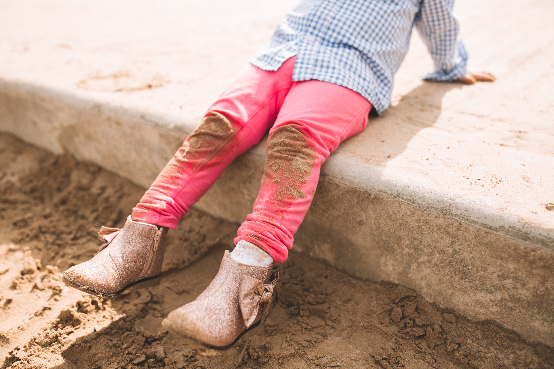 Toddler playing with sand