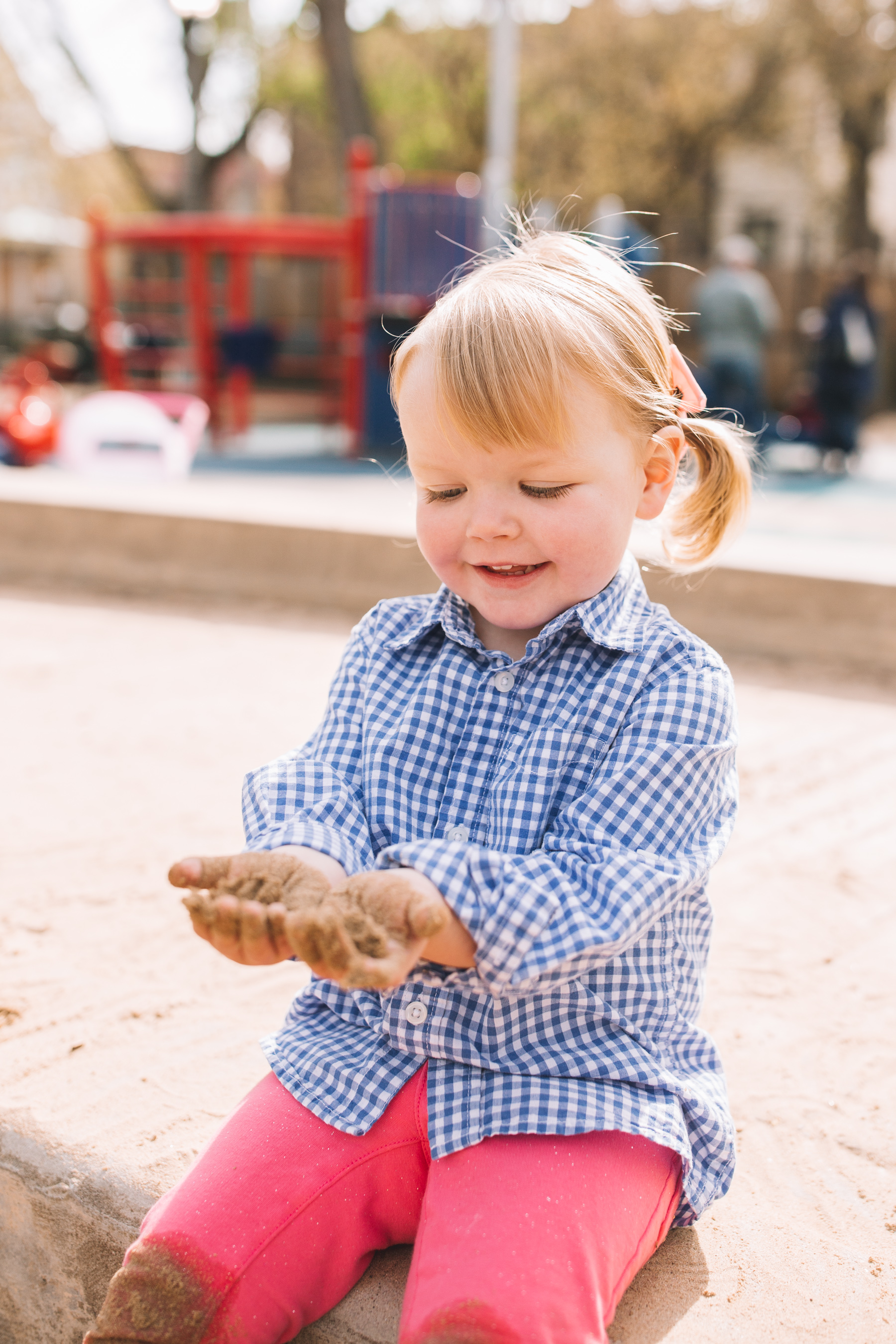 Emma is playing with sand