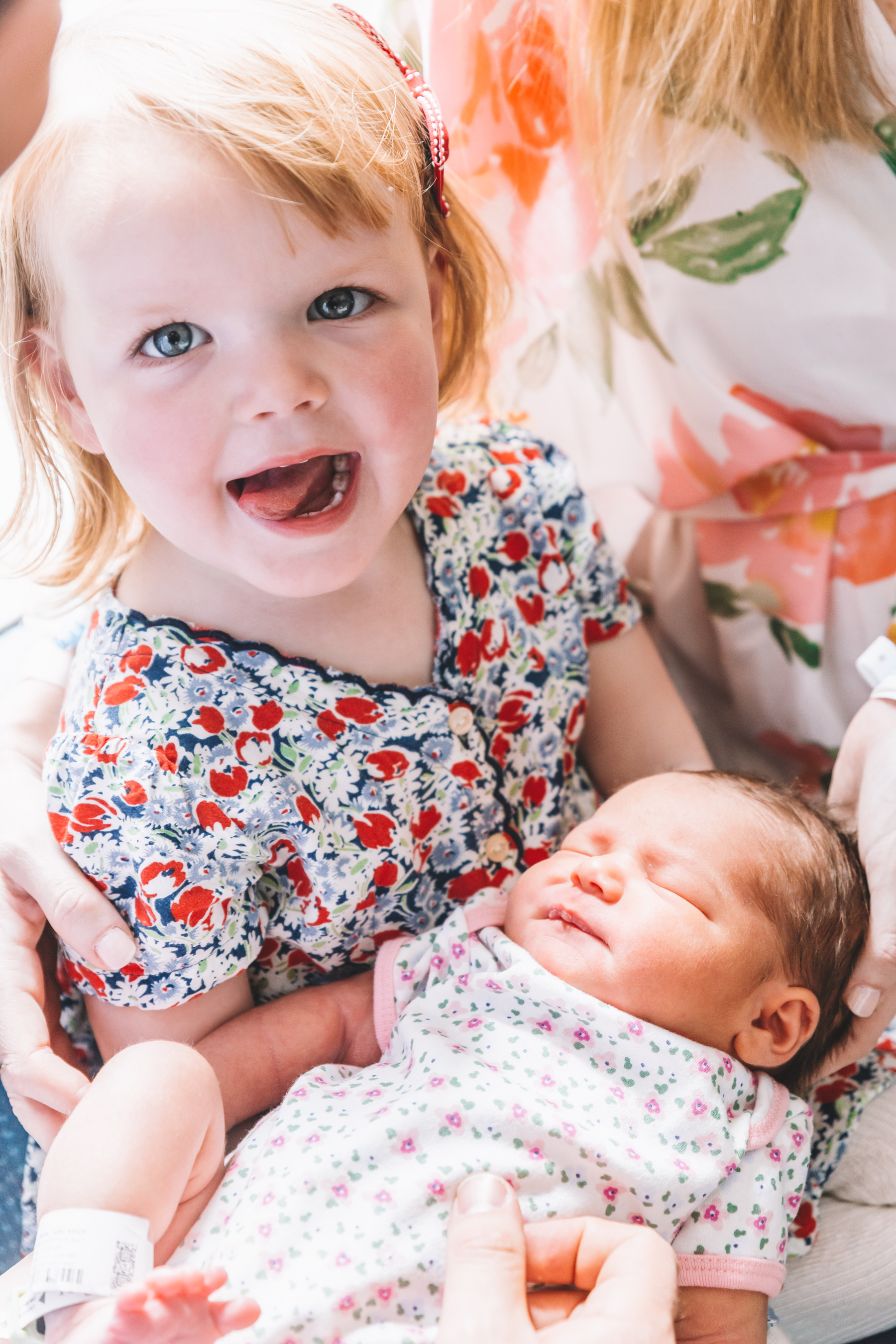 Emma is holding her sister Lucy Larkin