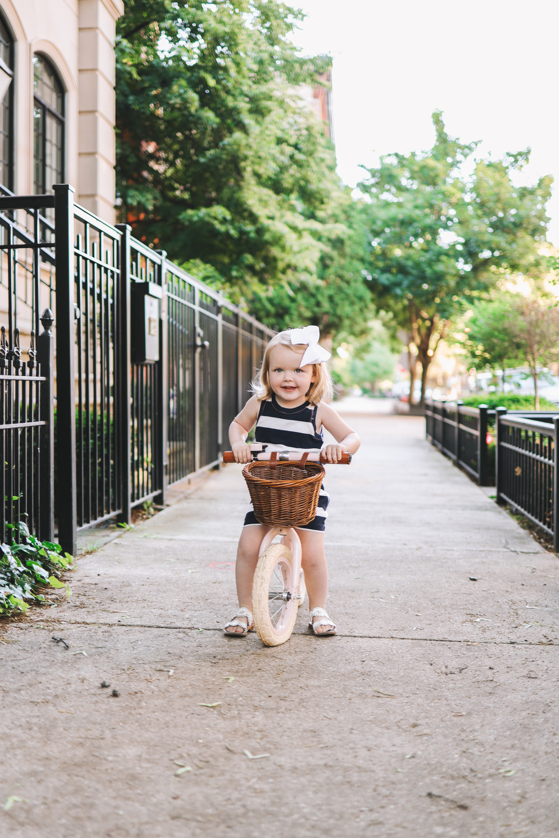 Emma is wearing a Girls' rugby-stripe dress J.Crew