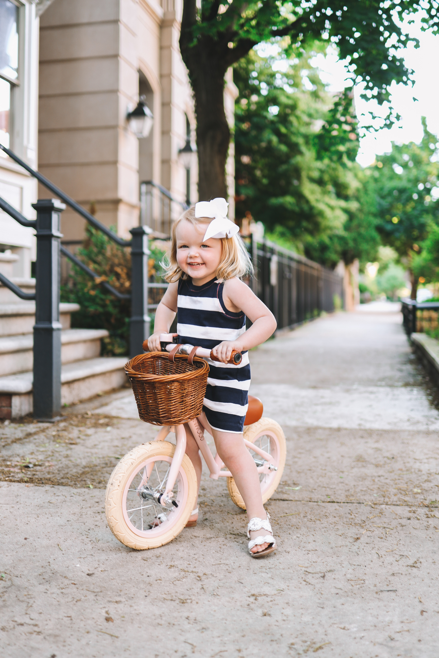 Emma is wearing a Girls' rugby-stripe dress J.Crew