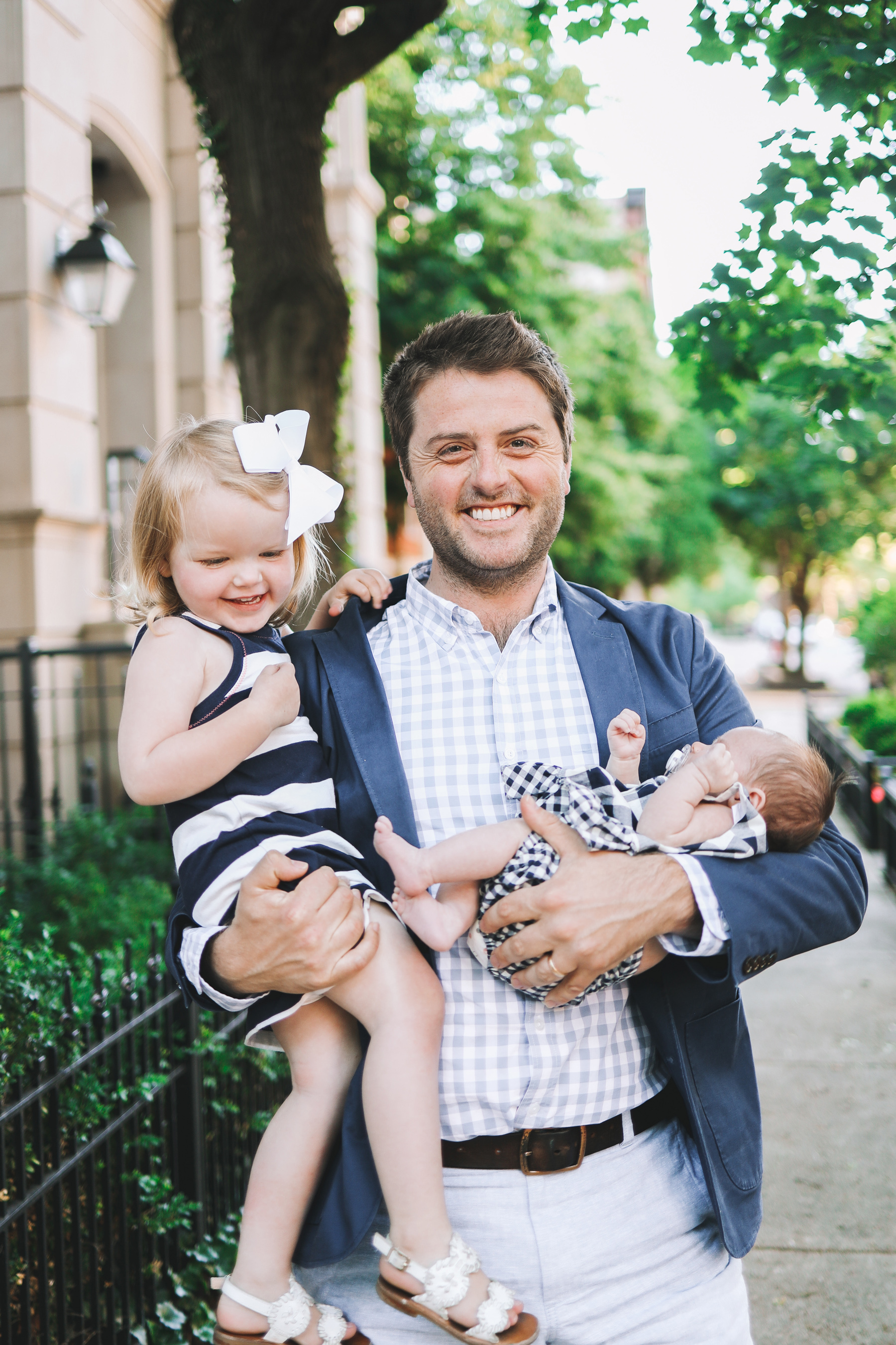 A happy father with his daughters 