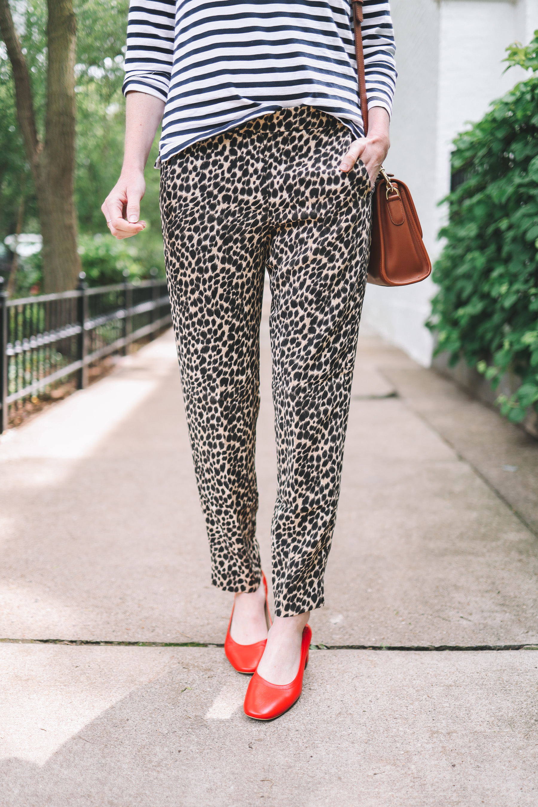 Kelly Larkin's outfit details: J.Crew Factory Pull-On Leopard Jamie Pants / Everlane Day Heels / J.Crew Striped Tee / Crossbody / Maxi-Cosi Carrier