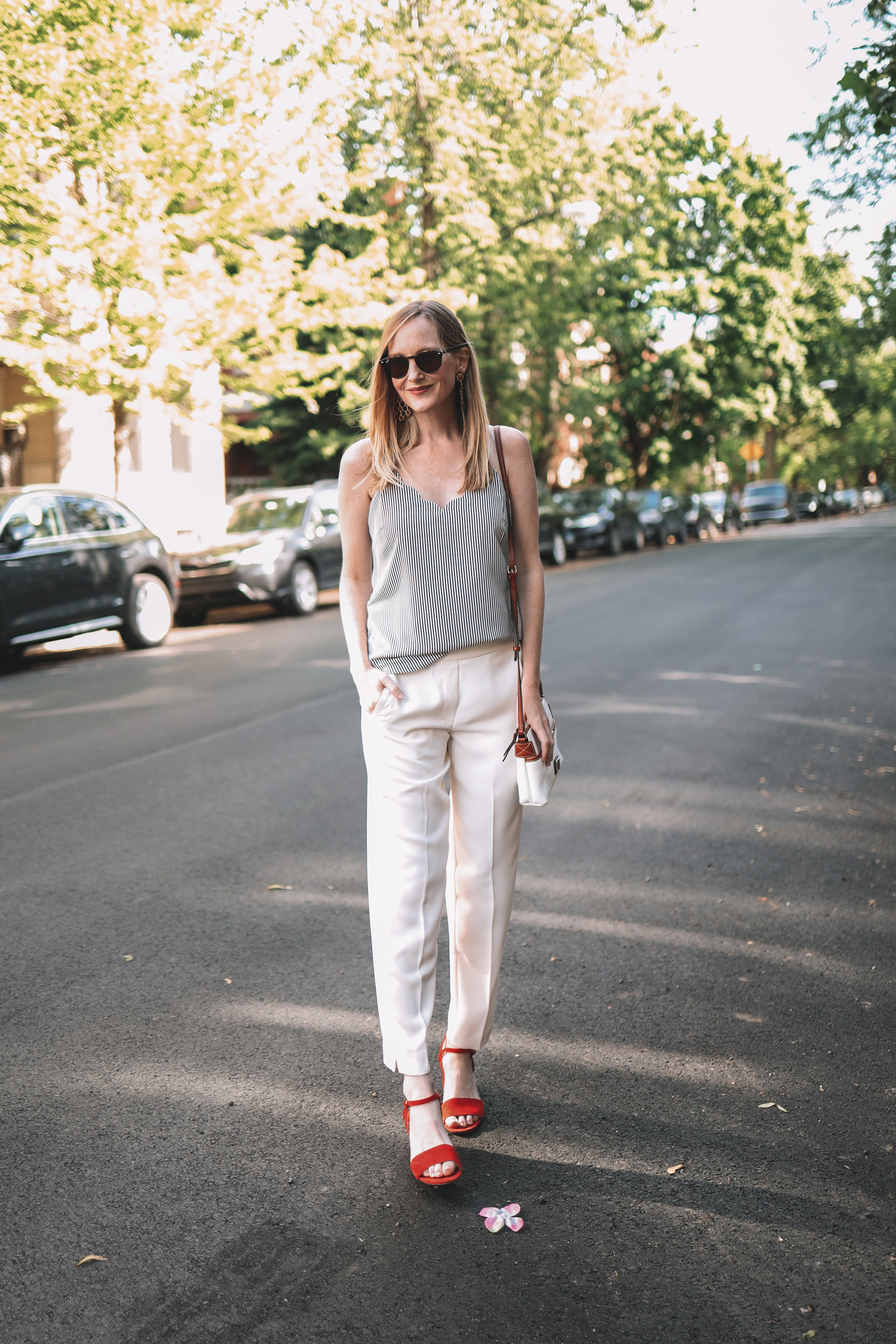 Kelly's outfit details: J.Crew Factory Scalloped Camisole / Pull-On Dress Pants / Red Sandals / Dooney & Bourke Bag / Lisi Lerch Earrings / Ray-Ban Sunglasses