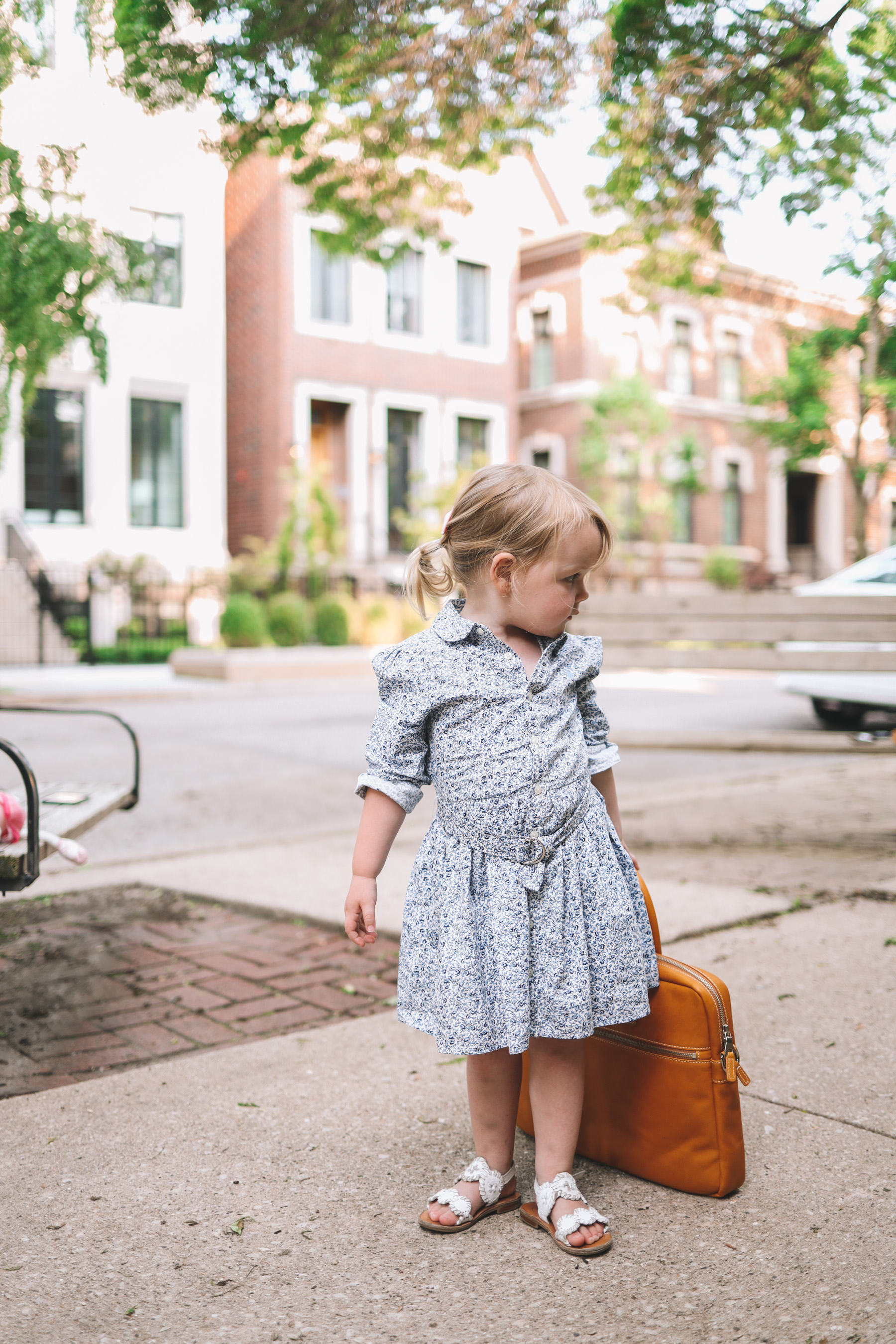 Emma is carrying a Leather Briefcase from Mark and Graham 