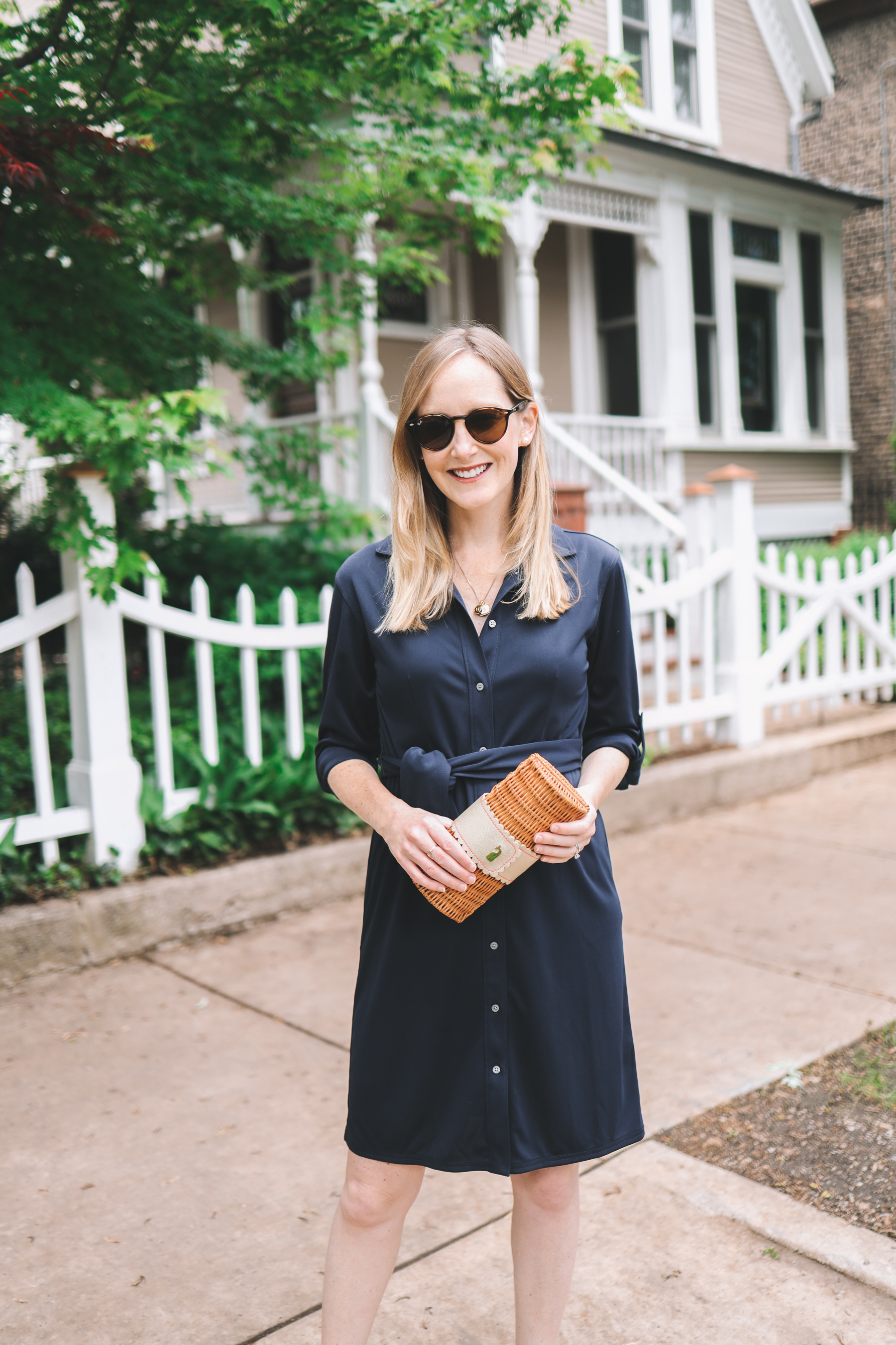 Kelly is wearing a J.Crew Navy Tie-Waist Shirt Dress 