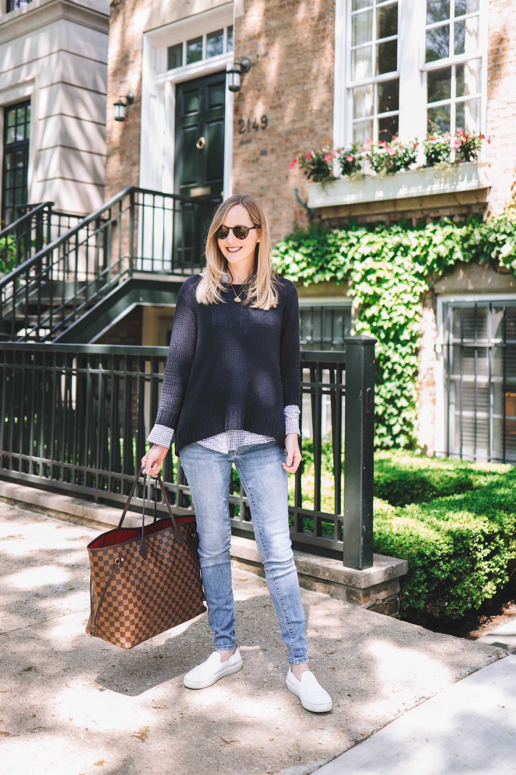 Kely's outfit details: Maternity Jeans / Rothy's Washable Sneakers / Tuckernuck Bow Sweater / J.McLaughlin Gingham Button-Down / Louis Vuitton Neverfull GM / Stamped Initial Necklace / Ray-Ban Sunglasses