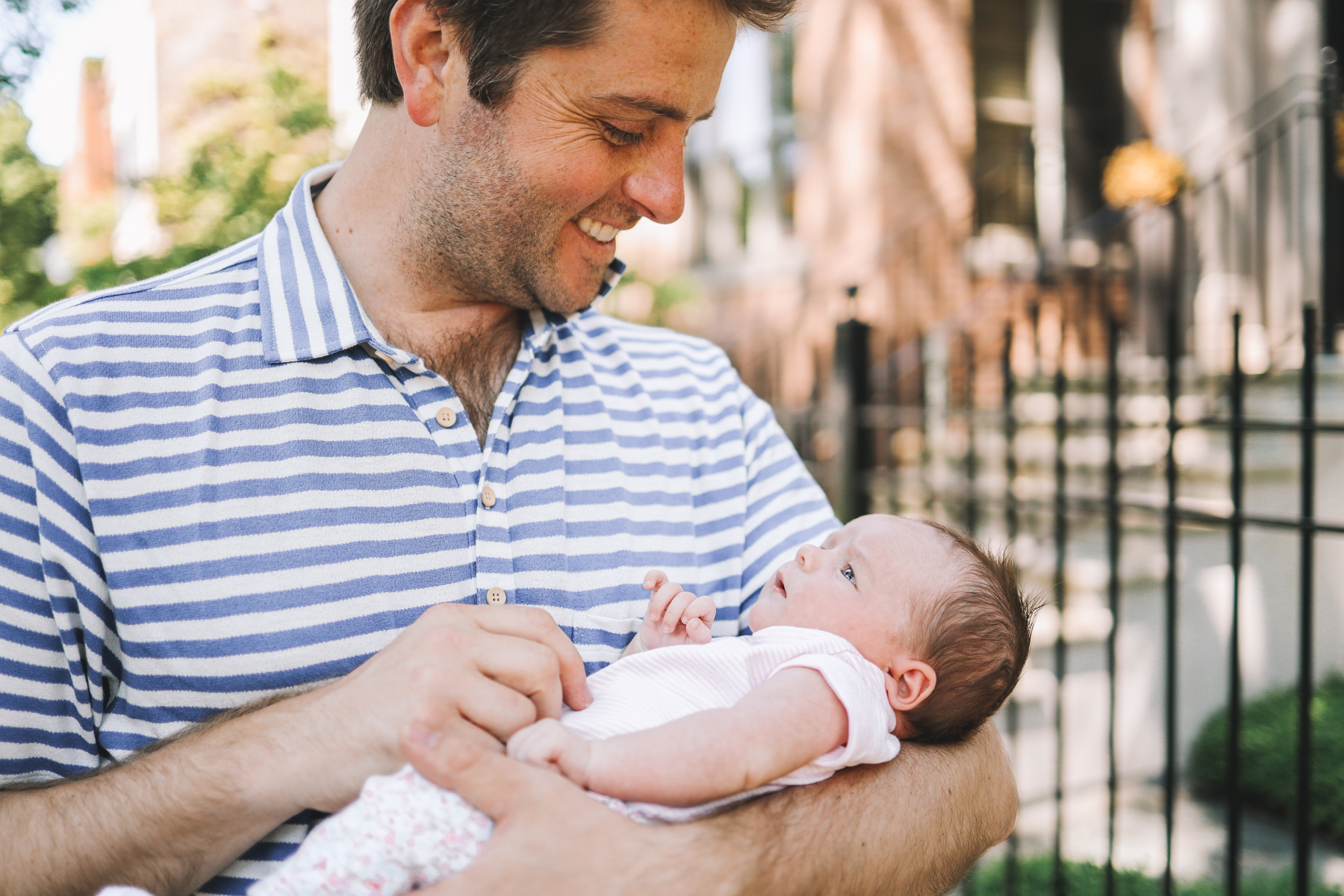 Father is holding his baby