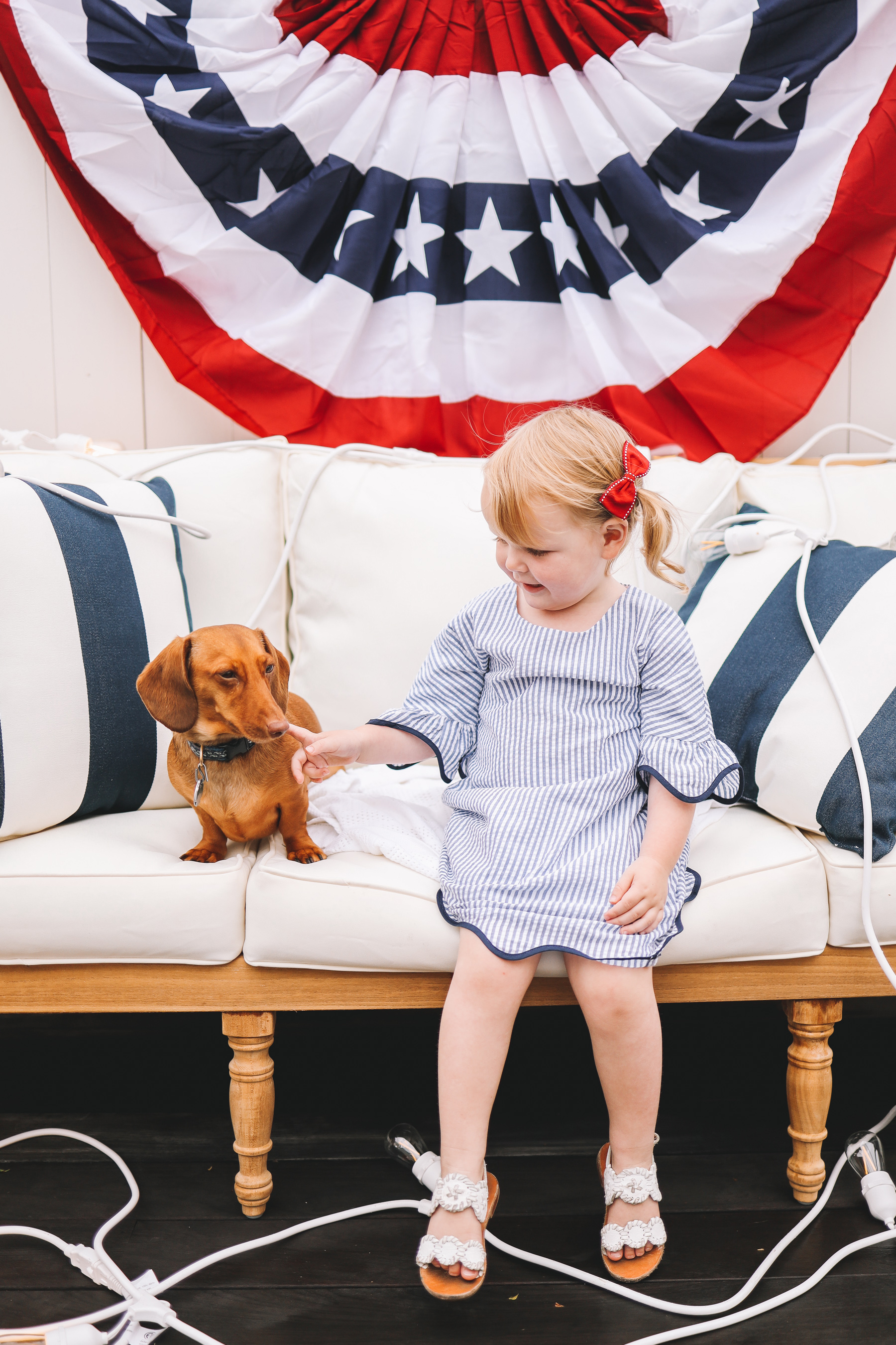 toddler and a dachshund dog