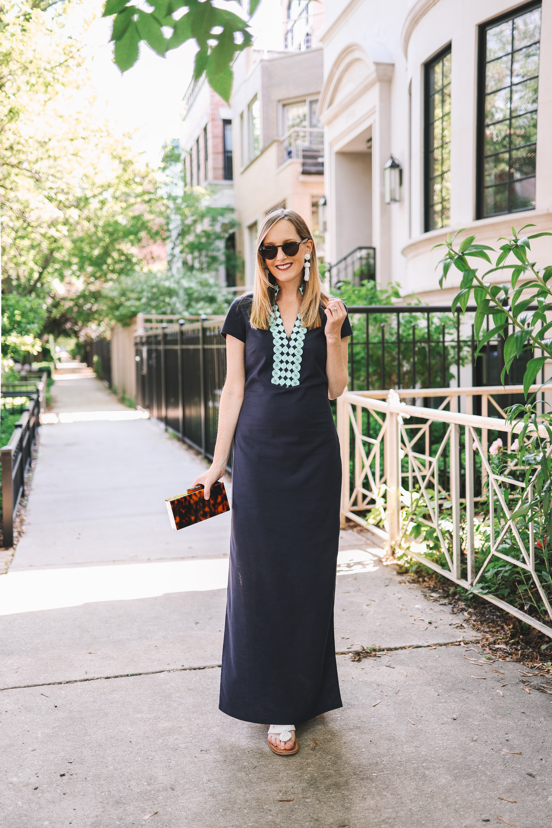 Kelly Larkin is wearing a Sail to Sable maxi dress