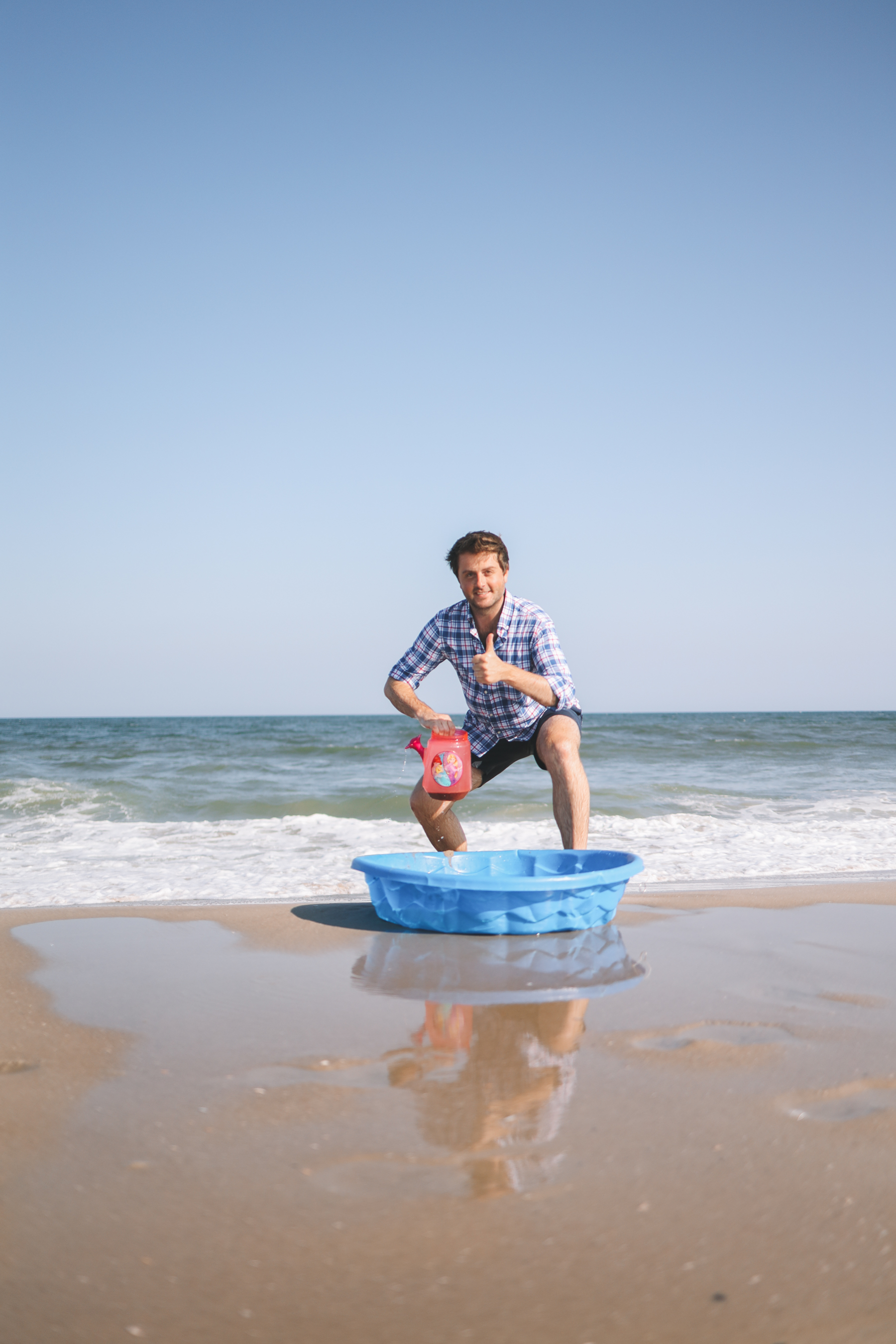 Kelly's husband giving a thumbs up while in the Ocean City waves