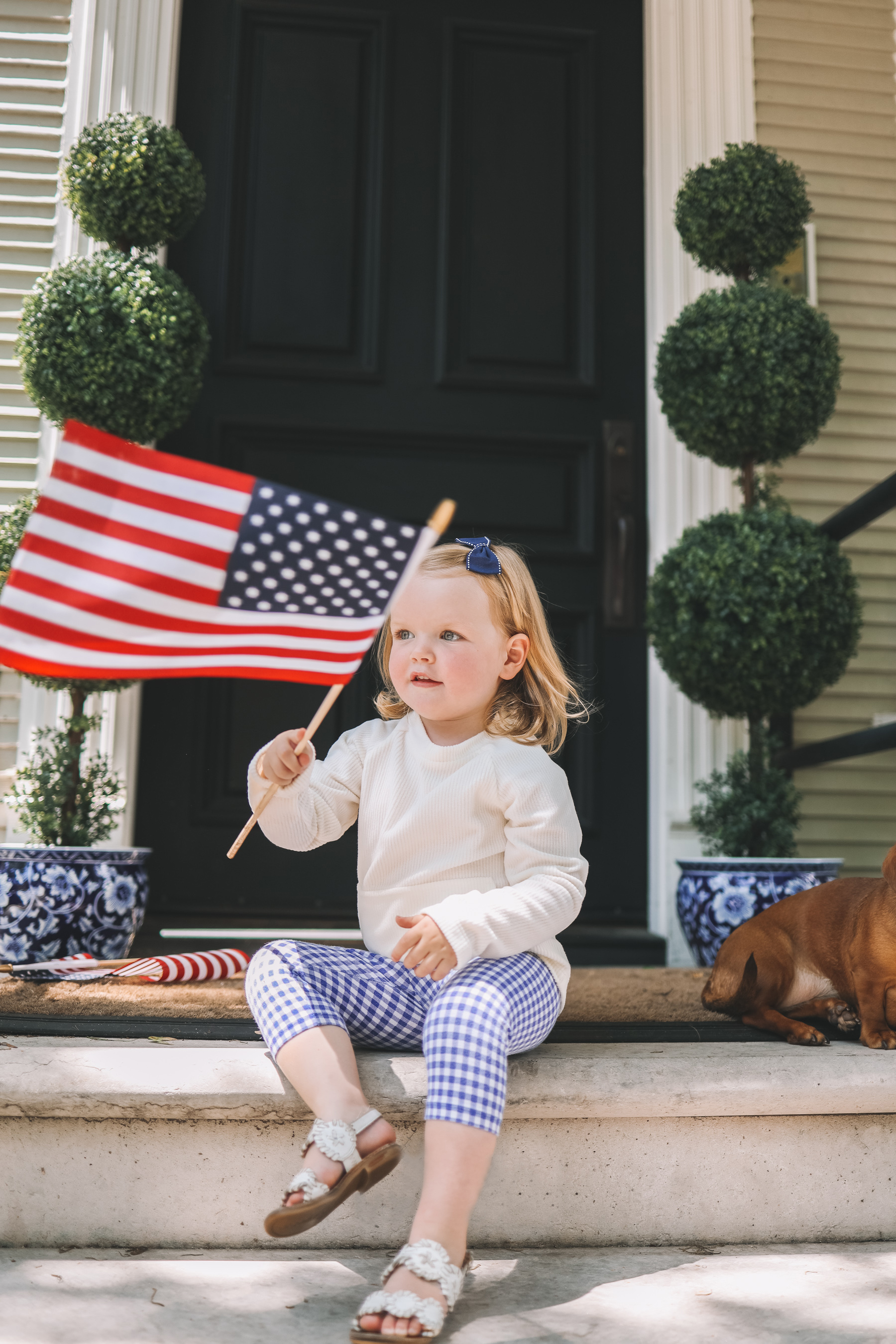 preppy girl holding the american flag
