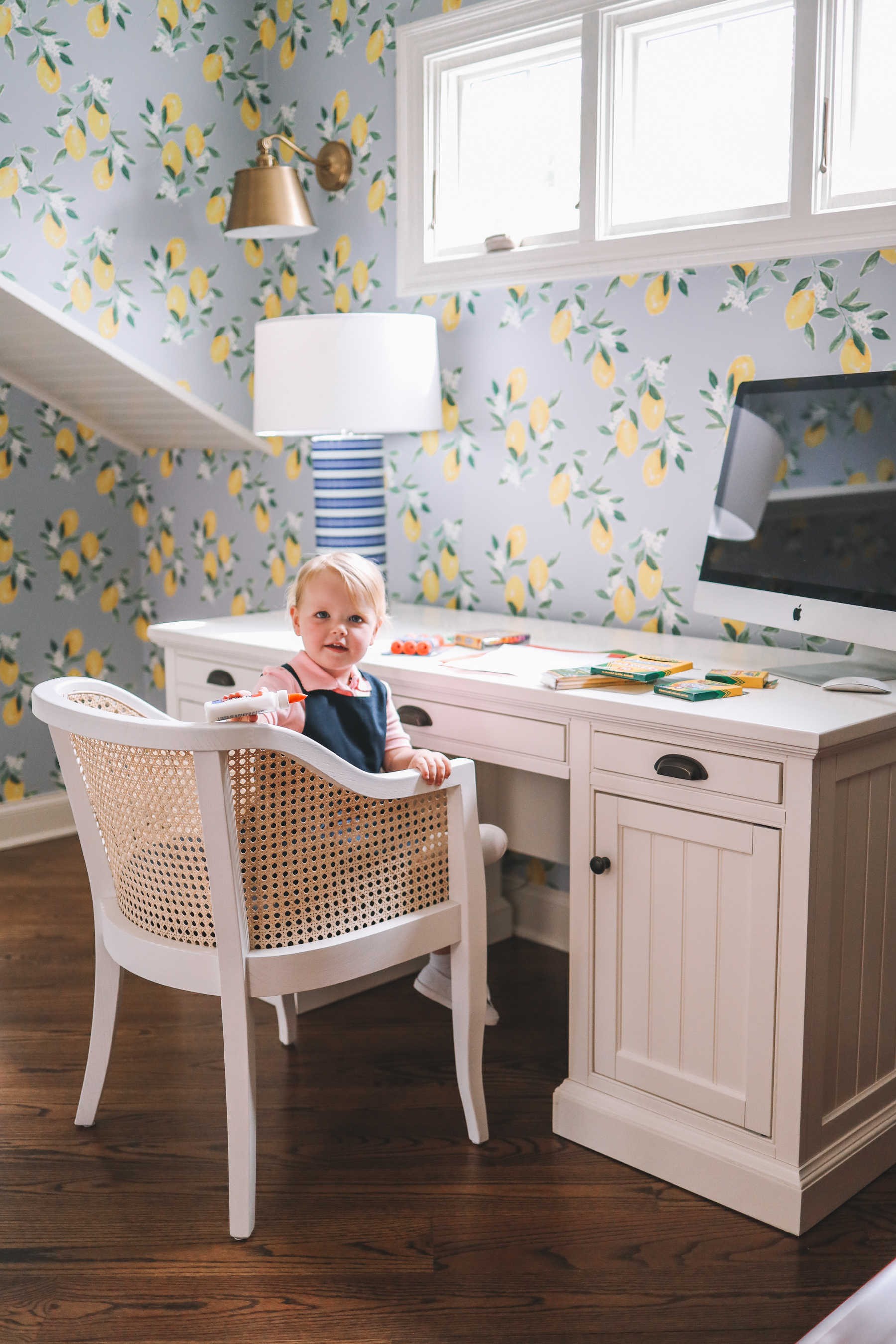 a little girl at a desk