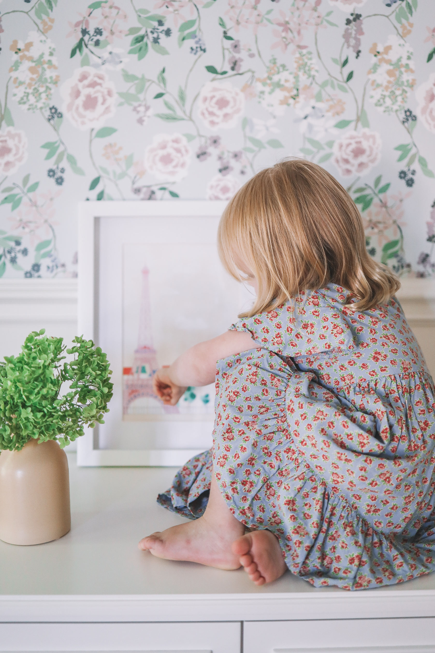 a little girl and floral home wall paper
