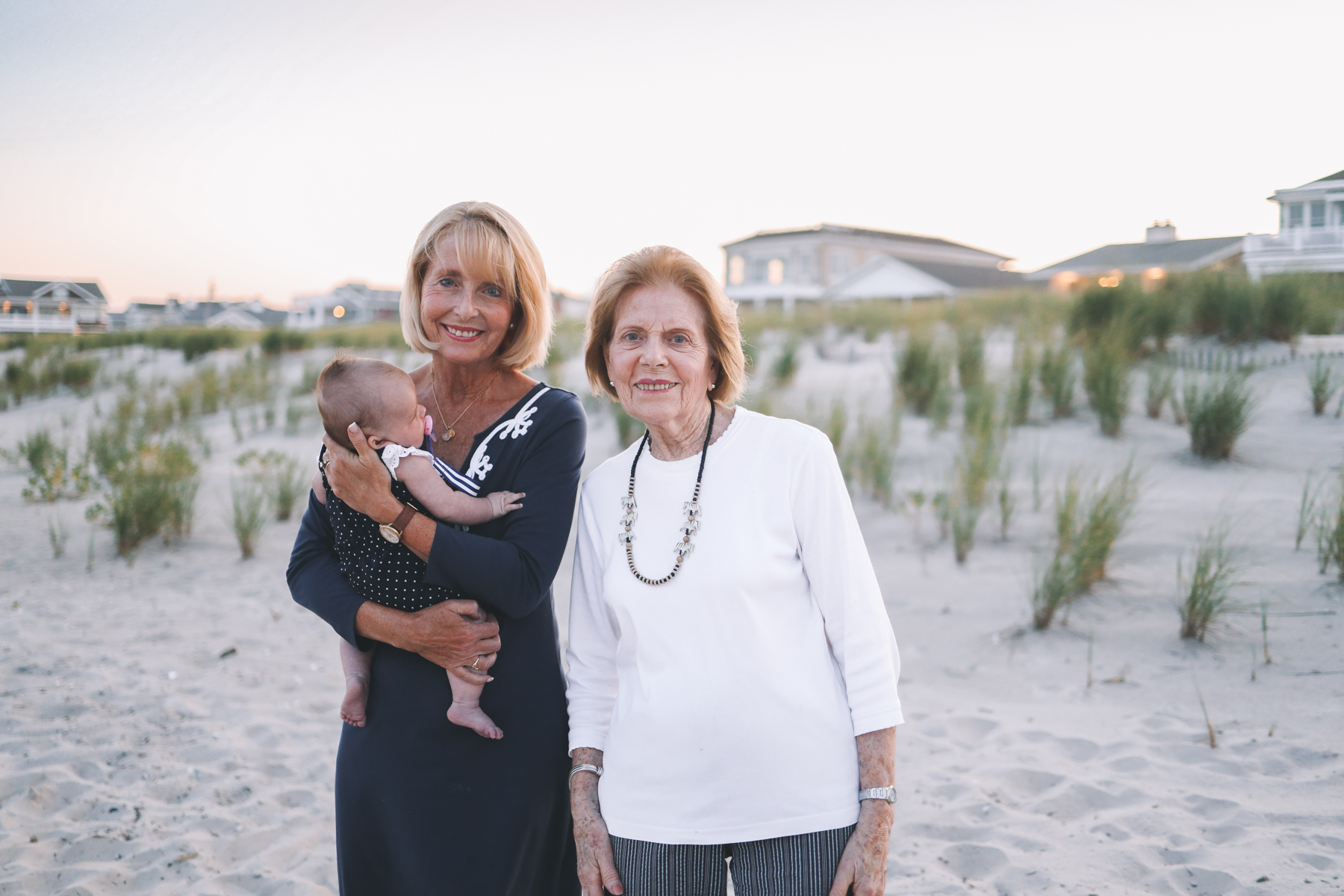 moms smile for family Christmas card photos