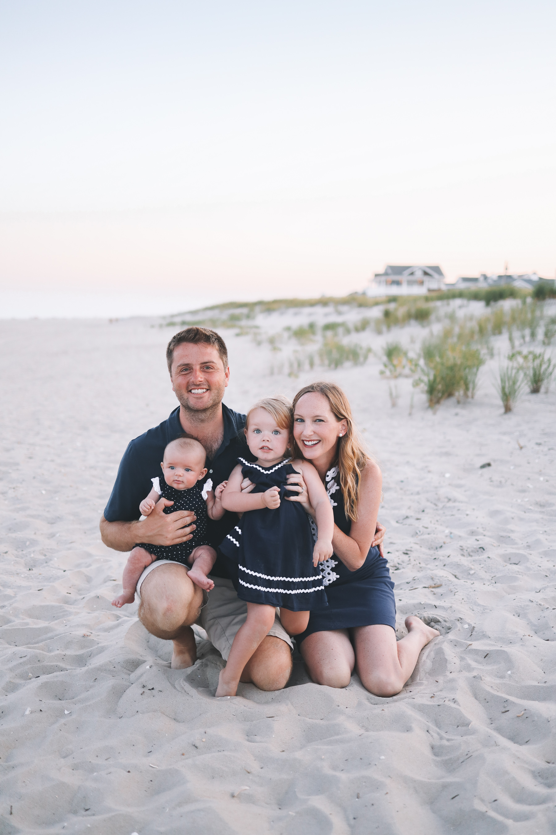 the family smile on the beach