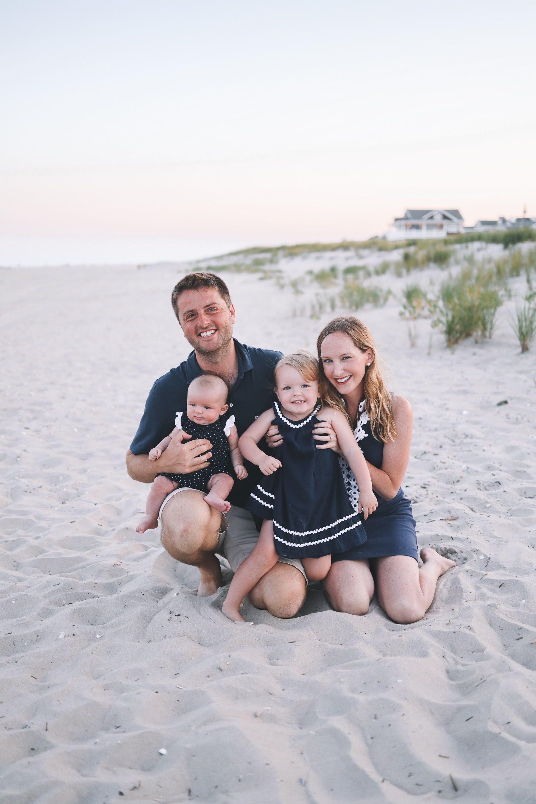 The babies and the mommy and daddy on the beachy