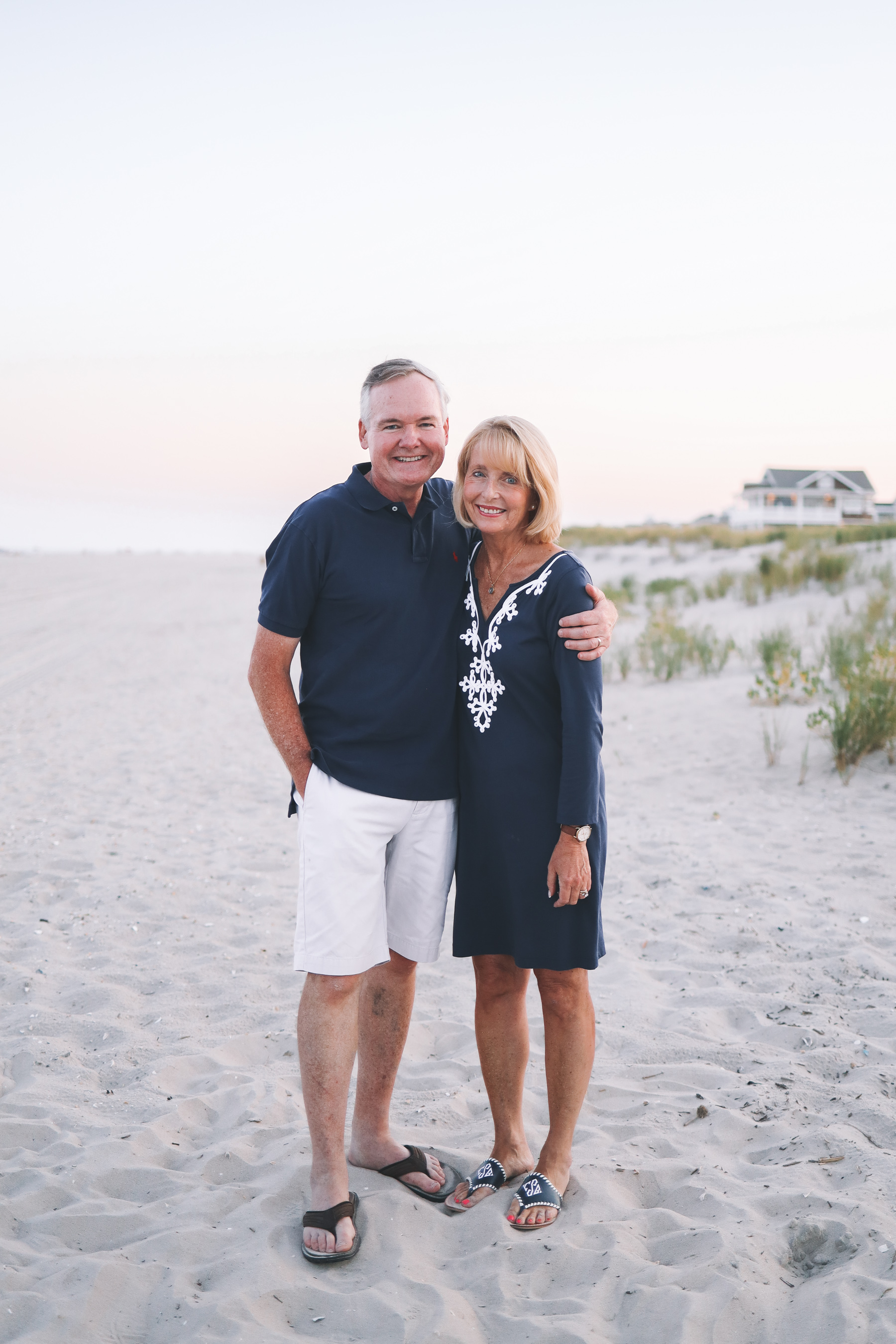 the couple smile for family Christmas card photos