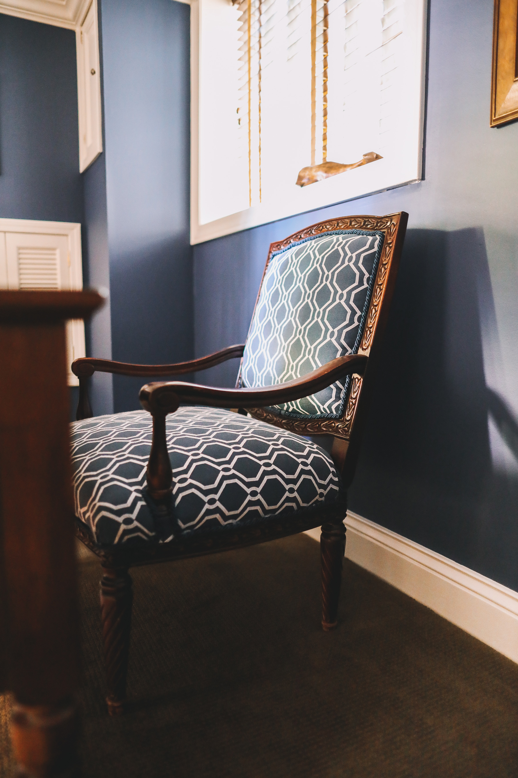 a blue chair in a study