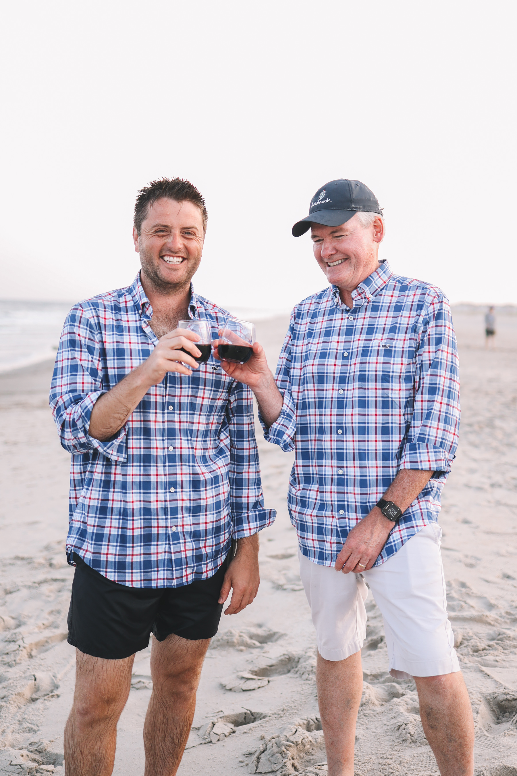 Two men splitting wine in Jersey at night