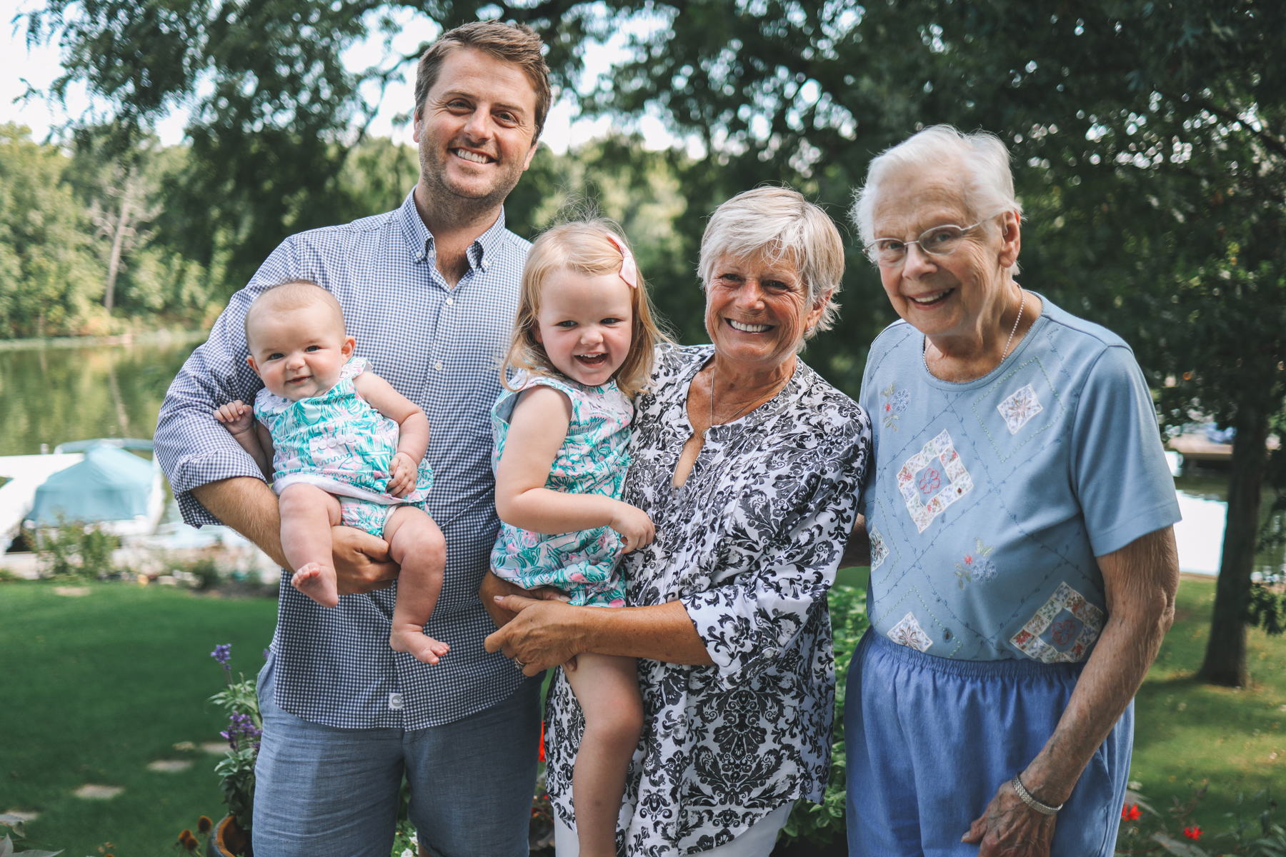 a big happy family with smiles and a green background