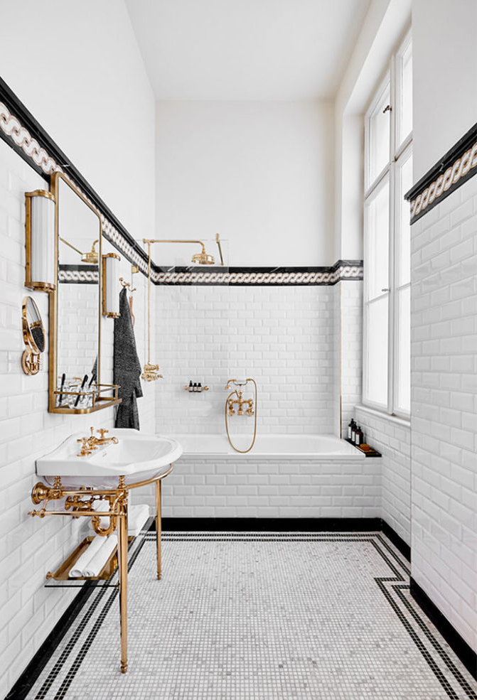 white and black bathroom // brass hardware // brass and glass