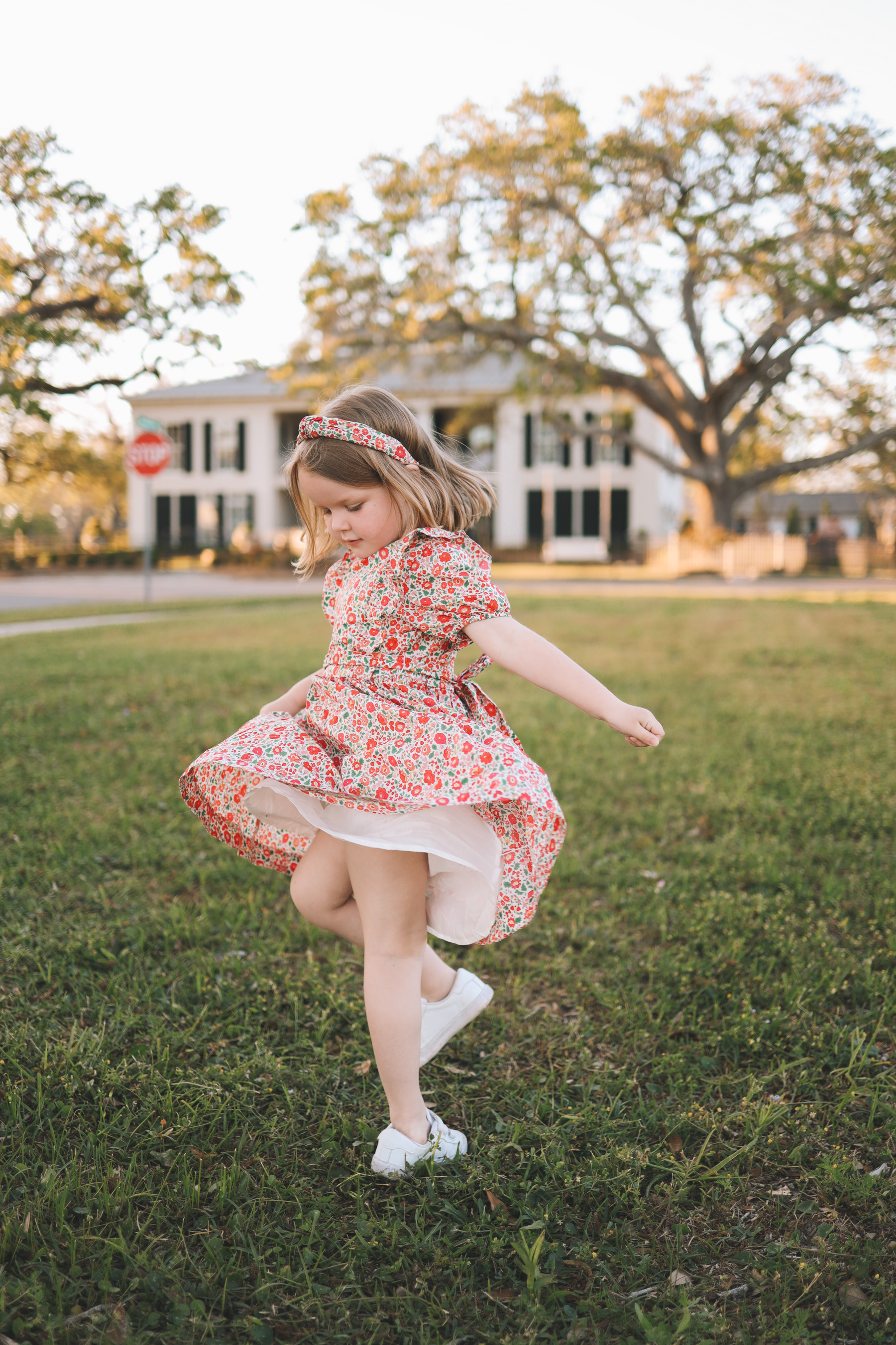 little girl twirling her dress