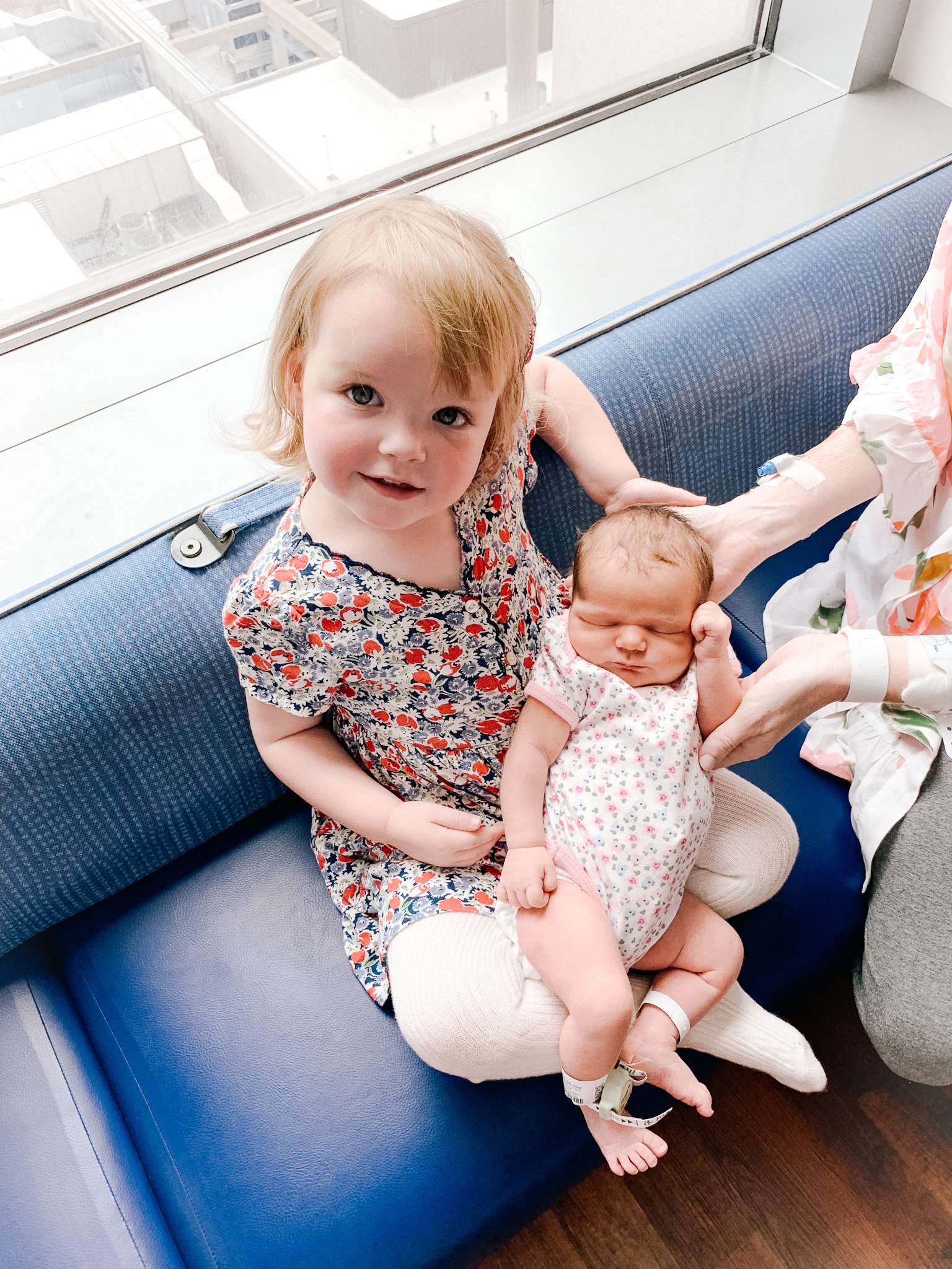 sister holding newborn | Lucys Delivery Story