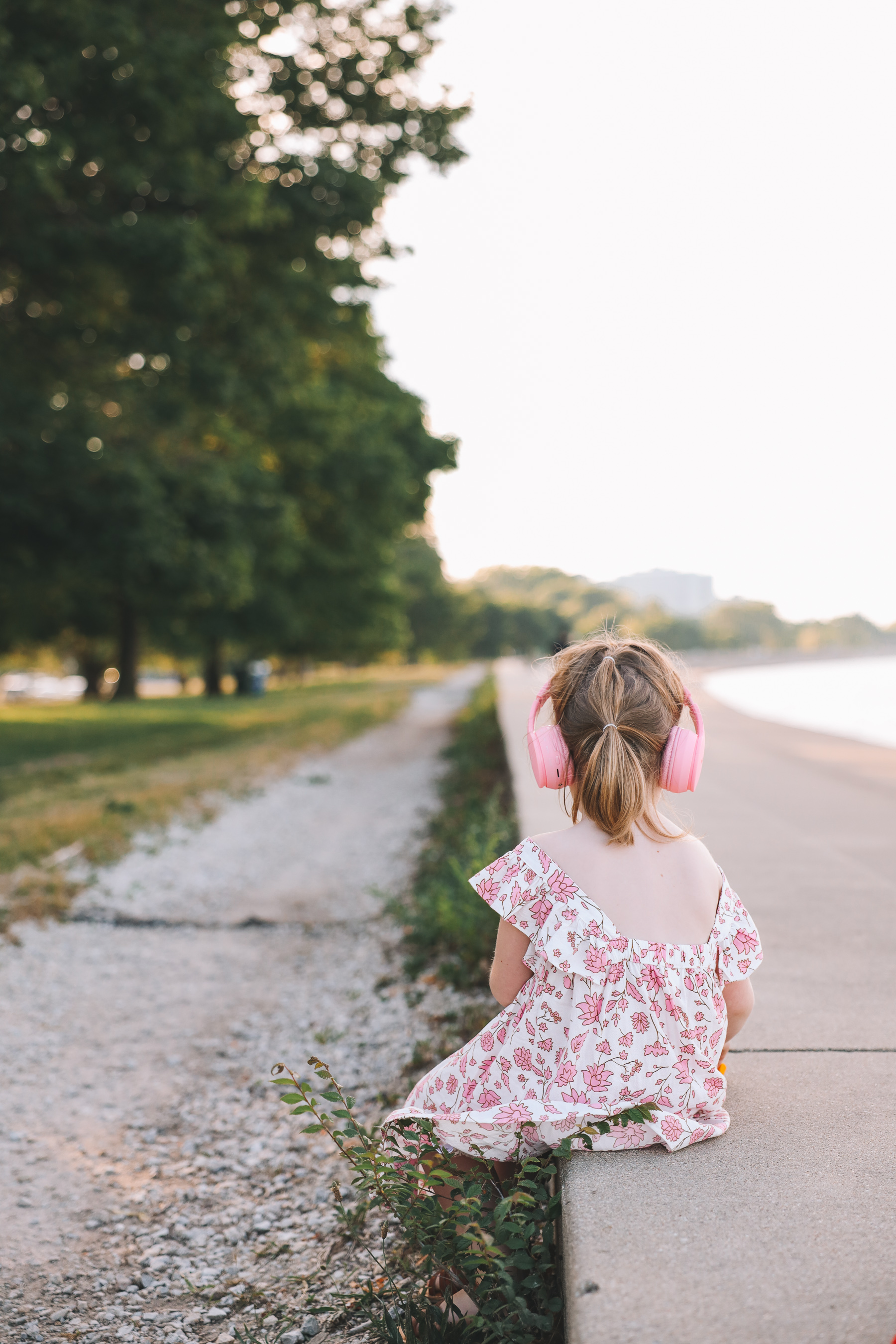 child facing back with headphones