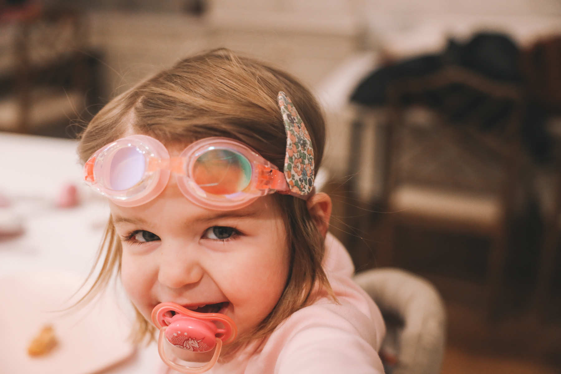 lucy with pacifier and goggles