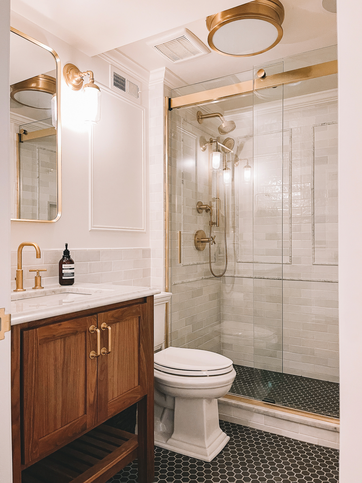 Case Remodeling -- towel hooks in shower, decorative floor drain