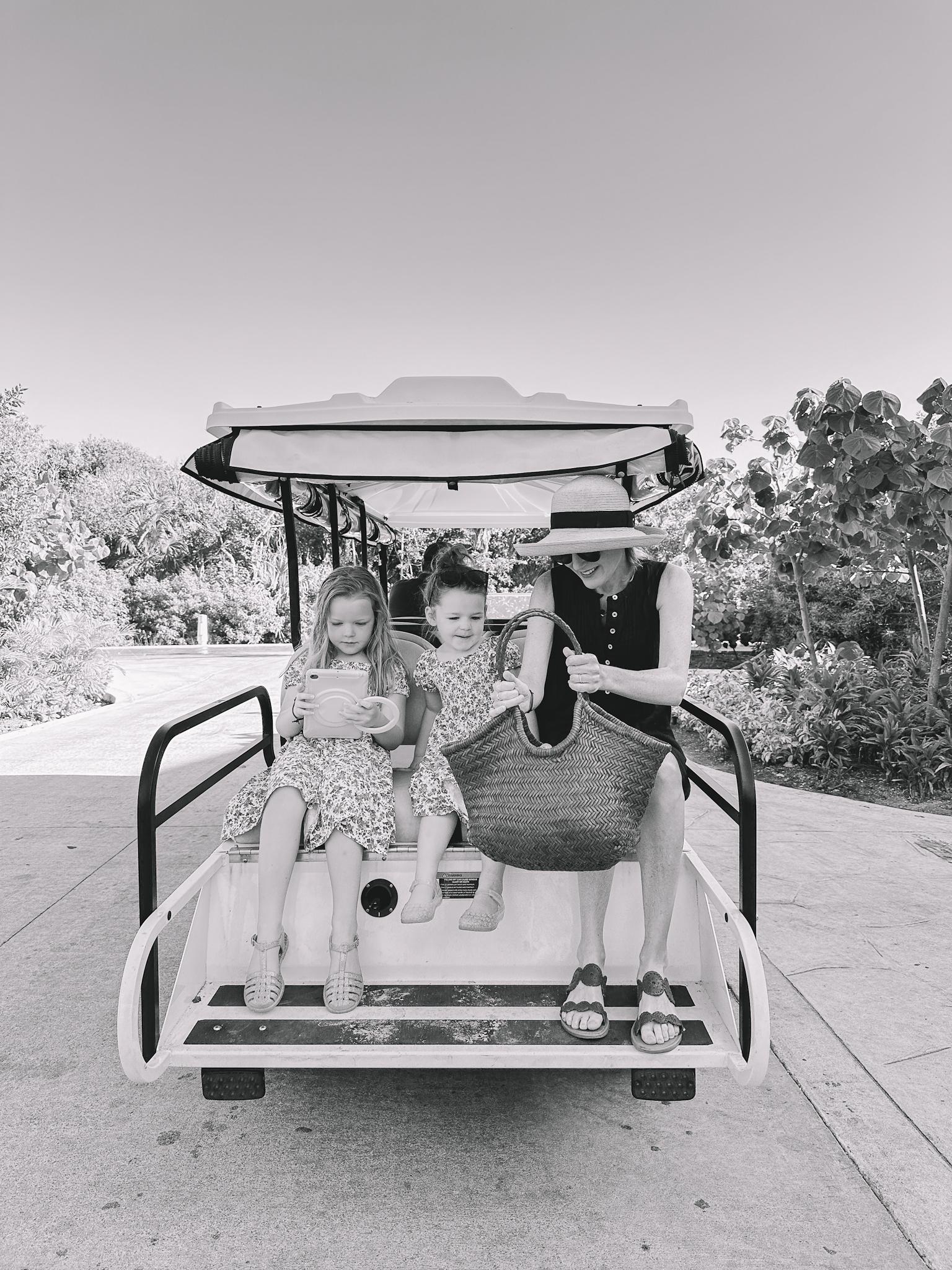 Kelly and kids in golf cart ride